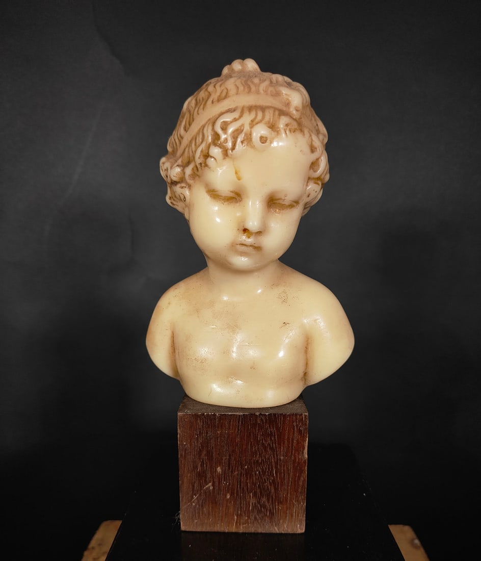 Bust of Cherub in wax, 19th century, Naples: TOTAL MEASURES: 22 CM. HEIGHT ONLY THE BUST 16 CM
