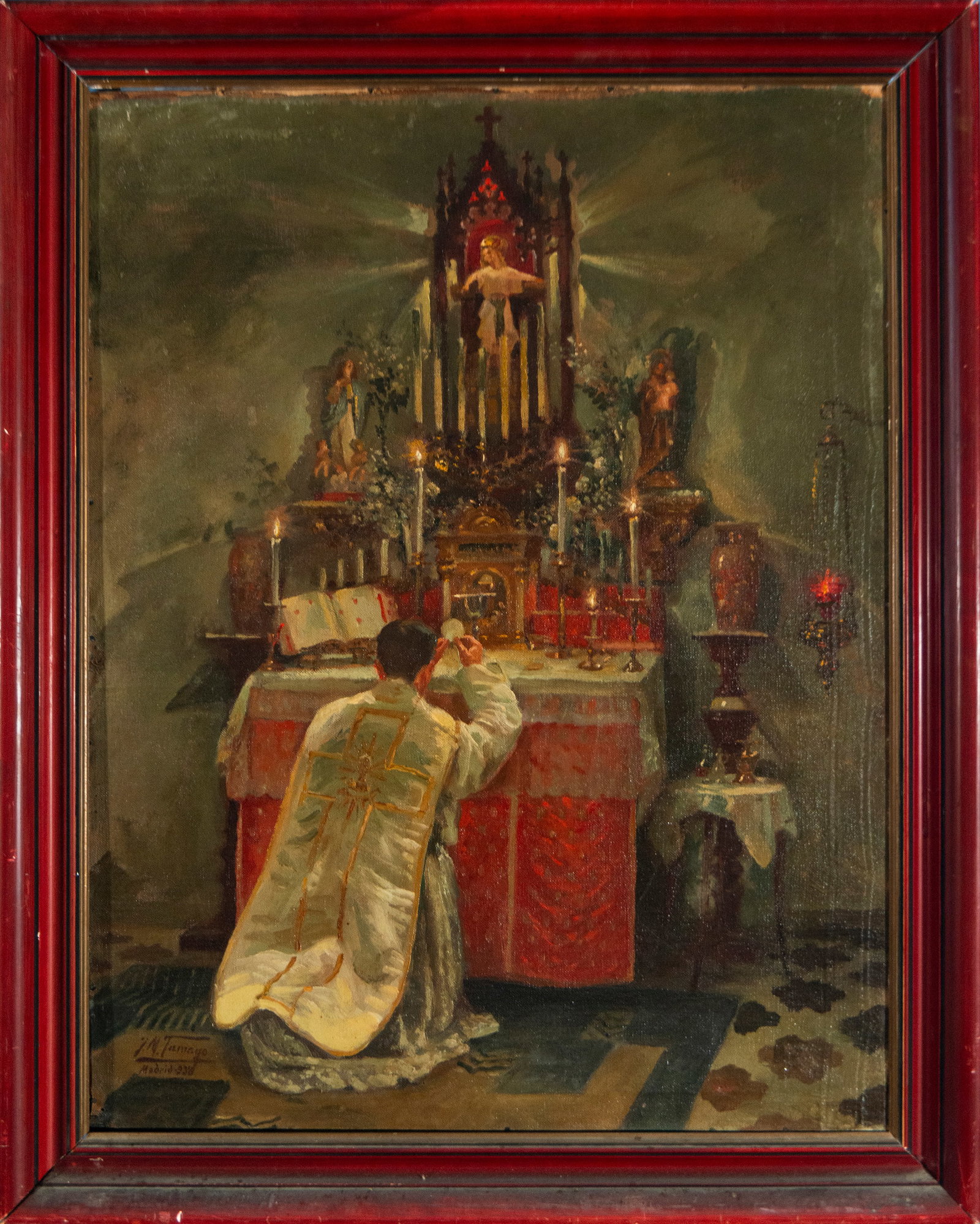 The Consecration. Signed: JM Tamayo, Madrid 1938. Spanish School. First half of the 20th century.: Oil on canvas. A priest kneeling before the altar performs the rite of consecration in an intimate and secluded space, where light seems to emanate symbolically from the tabernacle and the figure of C