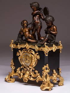 Louis XVI style Denière Paris table clock in gilt and patinated bronze, France, 19th century: Large Louis XVI-style mantel clock featuring three putti in bacchanal, with gilt bronze finials featuring plant motifs. Dimensions: 61 x 45 x 25 cm. Located in international warehouse. Located in inte