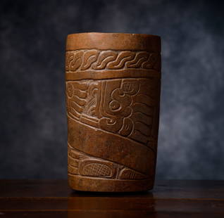 Rare and large pre-Columbian Mayan chocolate vessel in embossed ceramic. 200 BC, Mayan Empire -: Provenance: Important European private collection. The "Maya Chocolate Vessel" is a cylindrical, sculpted ceramic container crafted by the Maya civilization during the Classic Period (500-800 AD), a p