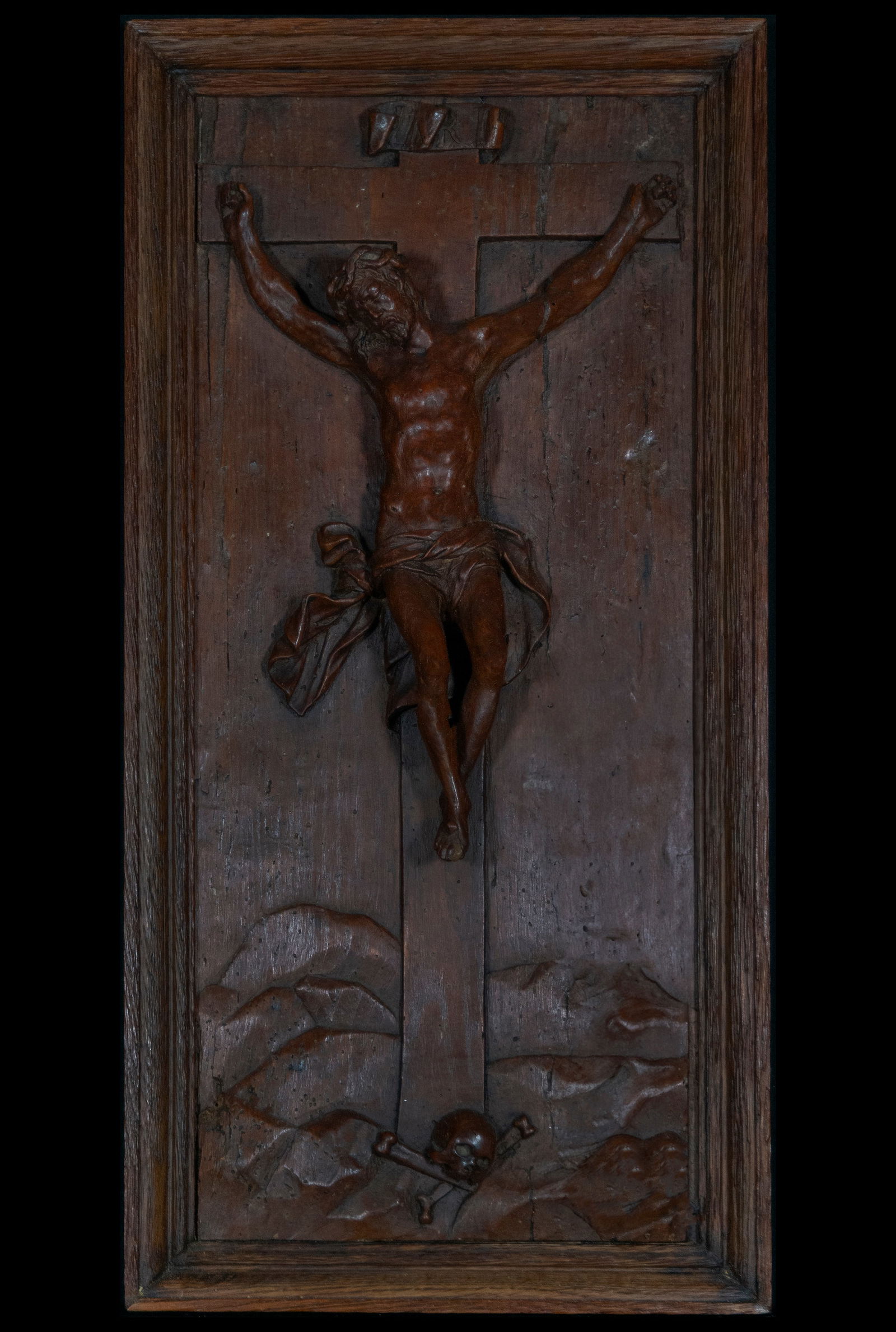 Christ Crucified in Relief, 17th Century, German School: This impressive wood-carved relief depicts Christ on the cross, a work that evokes the solemnity and intensity of Christ's sacrifice. The sculpture, dating from the 17th century and belonging to the G