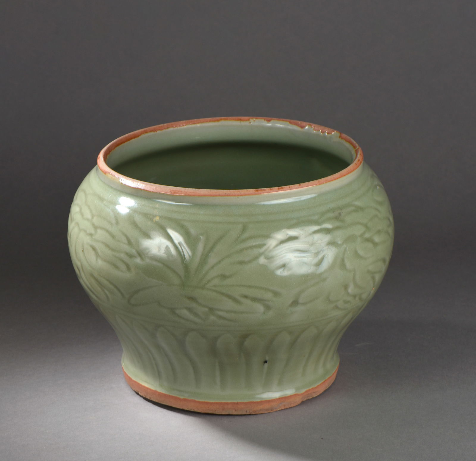 Celadon Jar with “Peony?? Motif. Yuan Dynasty, 1271–1368.: Porcelain. Yuan Dynasty. 1271 to 1368. Height 20 cm x diameter 21 cm. The piece has cracks.