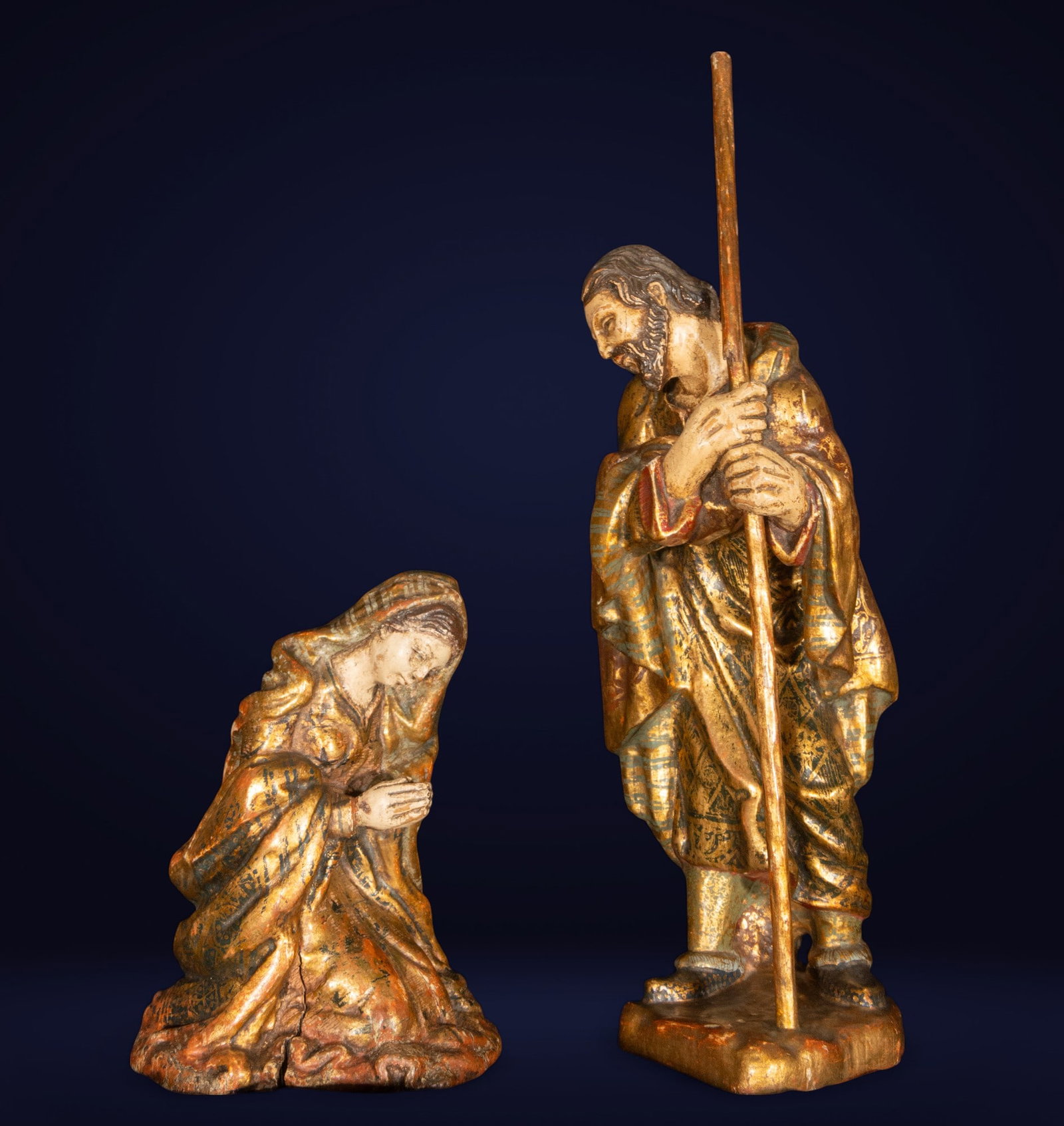 Virgin and Saint Joseph. 19th century.: Carved, polychrome, and embossed wood. A sculptural group in the round depicting the Virgin Mary and Saint Joseph, integral parts of the mystery of the Nativity, in an attitude of adoration. The Virgi