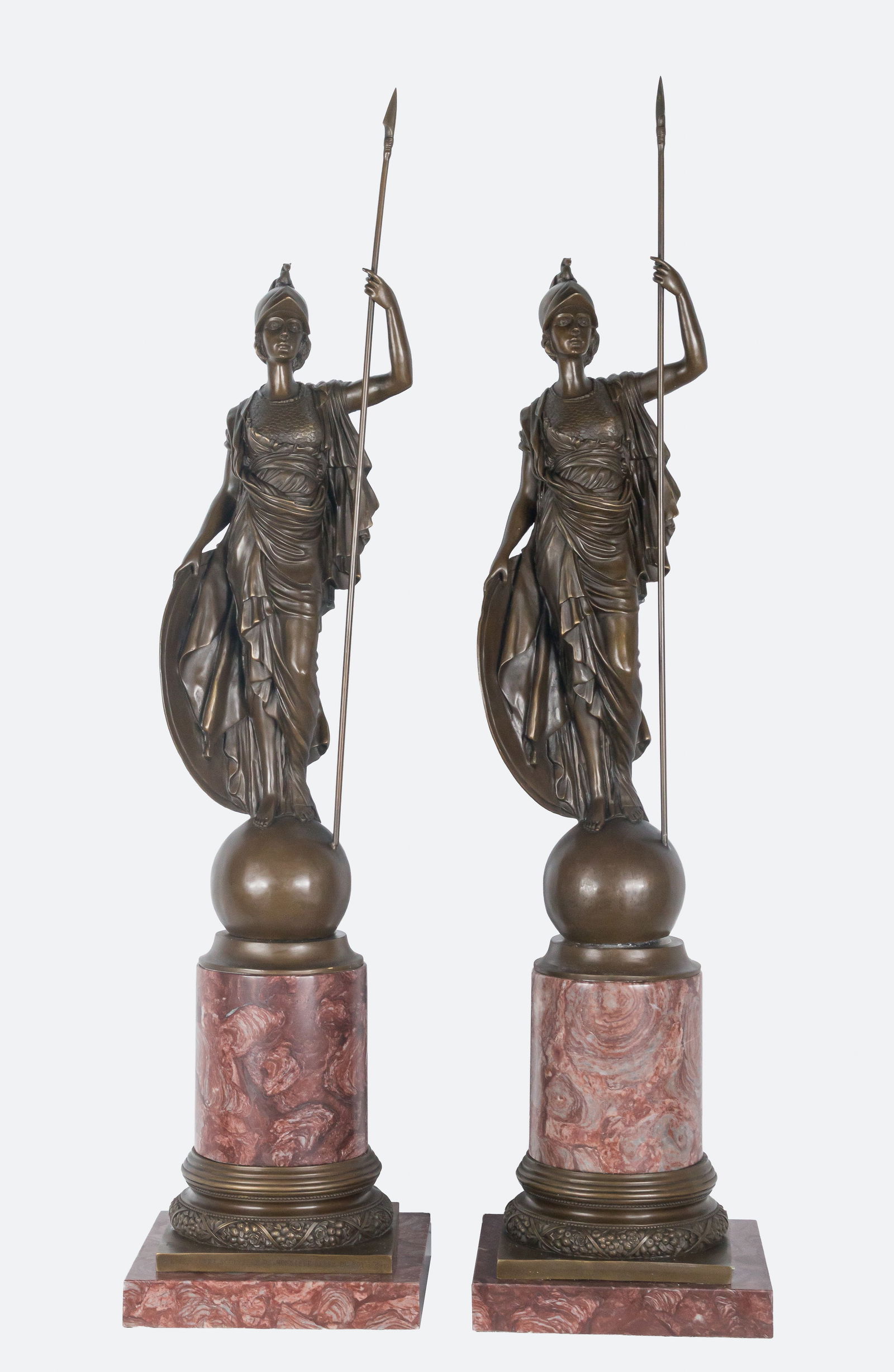 Pallas Athena. Signed Nick. French School. 18th century: Patinated bronze on a red marble base. Dimensions: 102 x 26 x 28 cm. A sculptural pair representing the goddess Athena (Pallas Athena) with a spear and shield, placed on symbolic spheres. The treatmen