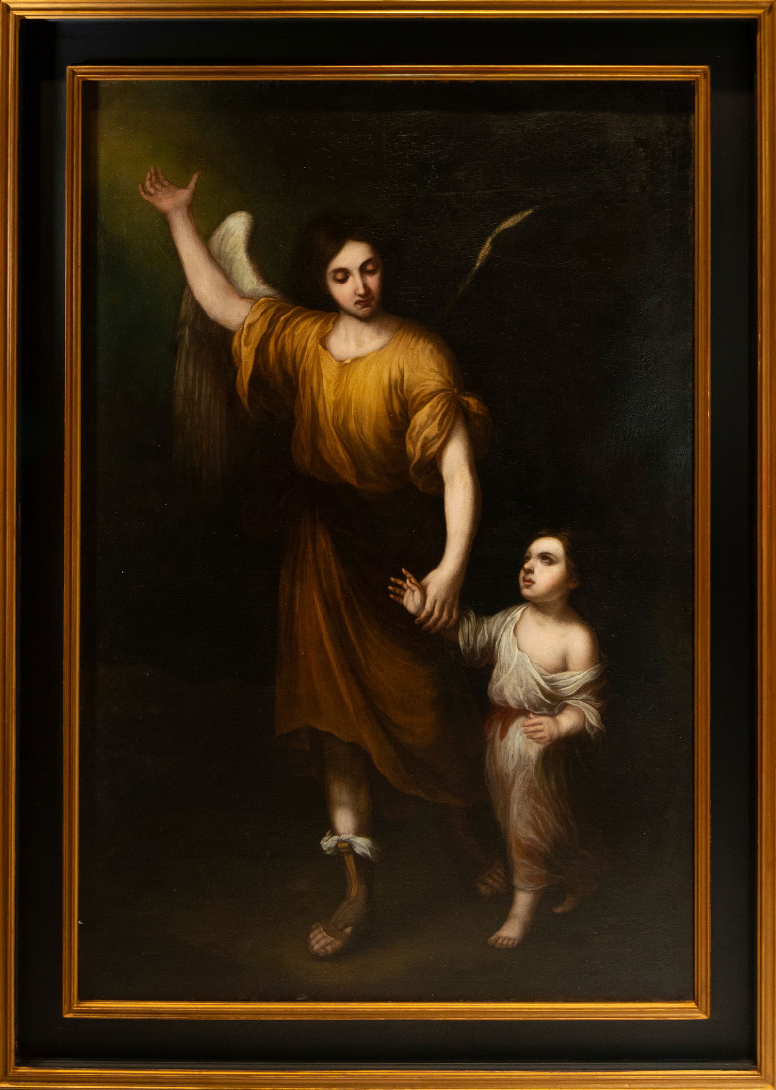 Guardian Angel with Child. Signed. Sevillian School. 17th Century.: Oil on canvas. Measurements: 176 × 118, 204 × 146 cm. The scene depicts a deeply devotional theme: a guardian angel leads a child by the hand, evoking divine protection and spiritual innocence. The