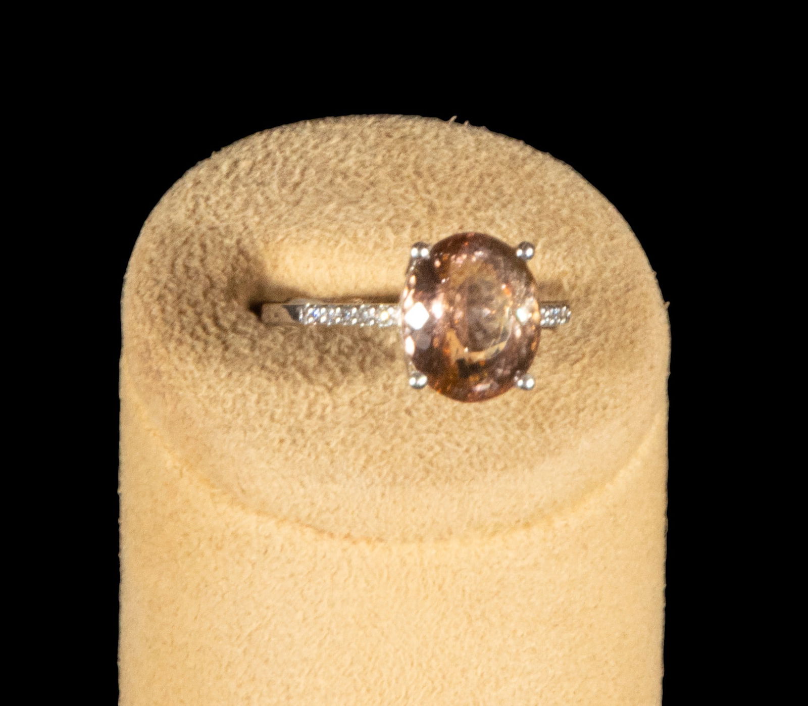 18k white gold ring with oval-cut pink tourmaline set in four prongs and decorated with (1 of 3)