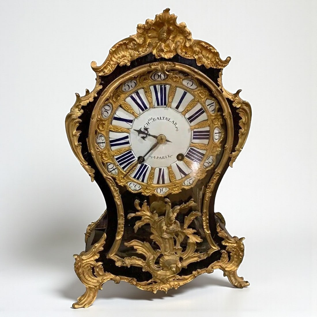 Mantel clock in ebonized wood with gilt bronze applications, signed Charles Baltazar, French School, (1 of 12)
