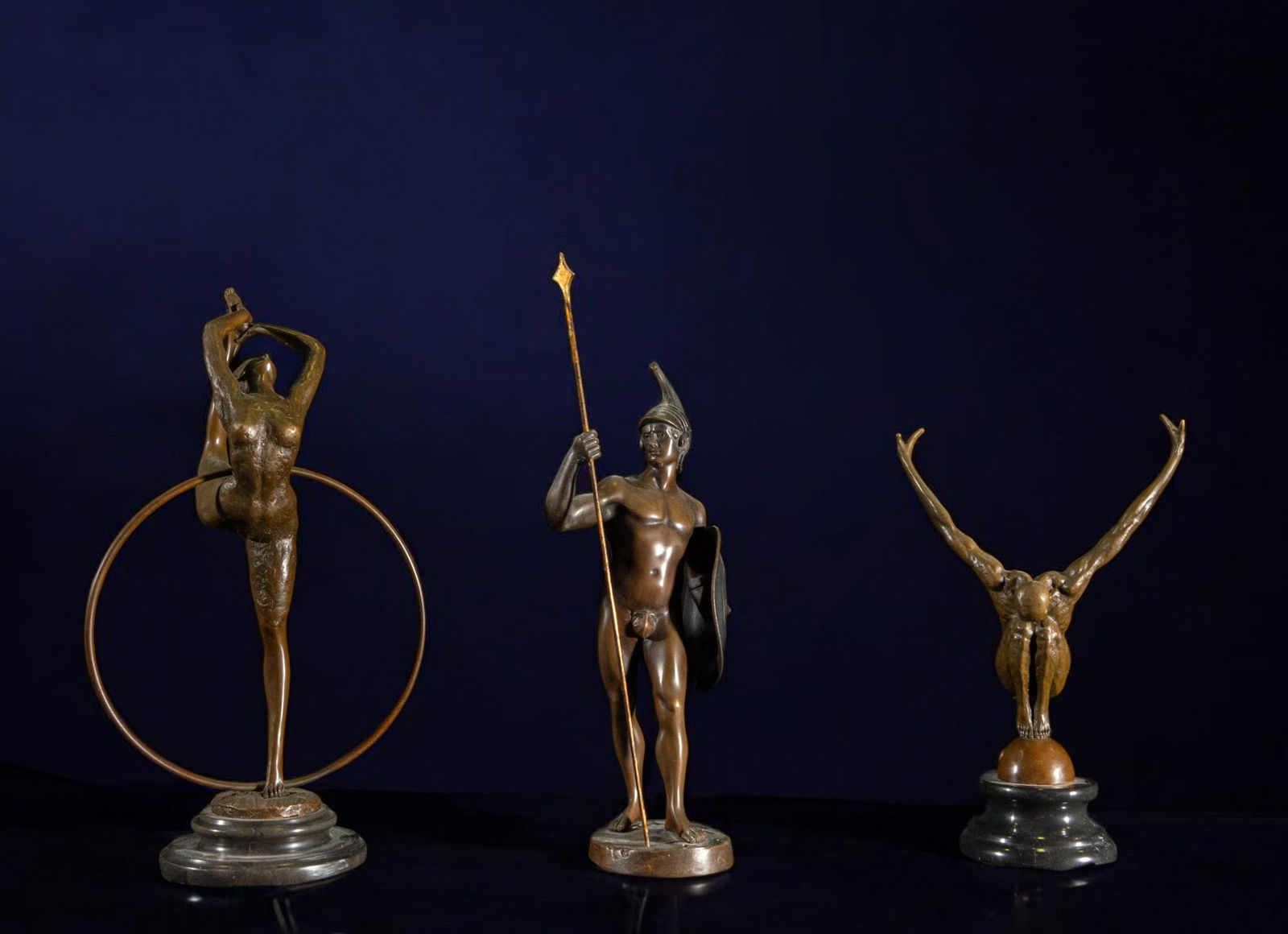 Lot of three 20th century bronze figures (dancer, Roman and male dancer): Bronze. Measurements: ballerina 40 cm x 23 cm x 14 cm, Roman 41 cm x 13 cm x 12 cm, dancer 30 cm x 21 cm x 12 cm