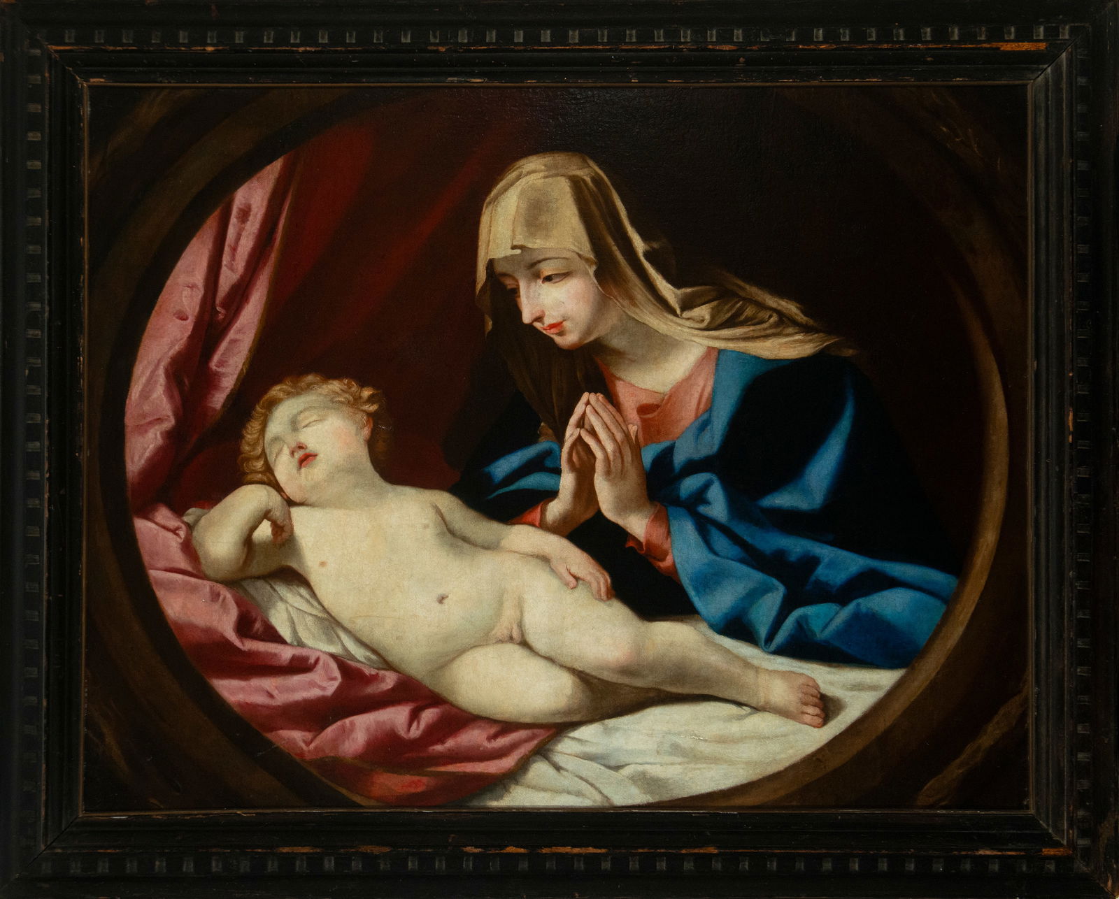 Following models of Guido Reni (Bologna, 1575-1642) - Madonna with the sleeping Child, 17th century: Oil on canvas. Measurements: 119 x 147 cm.