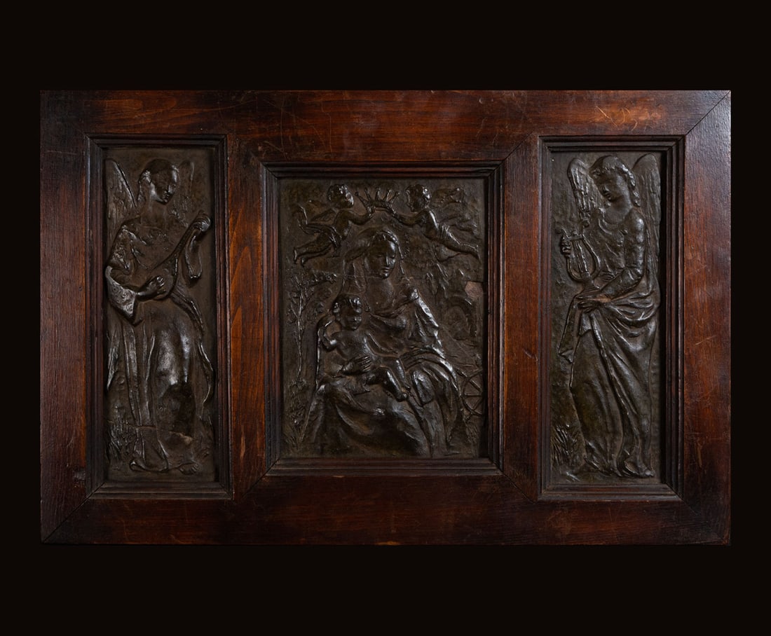 Triptych of Madonna and Child Surrounded by Singing Angels, 19th century Italian school: In terracotta and wood, measures: 36 x 56 in total.