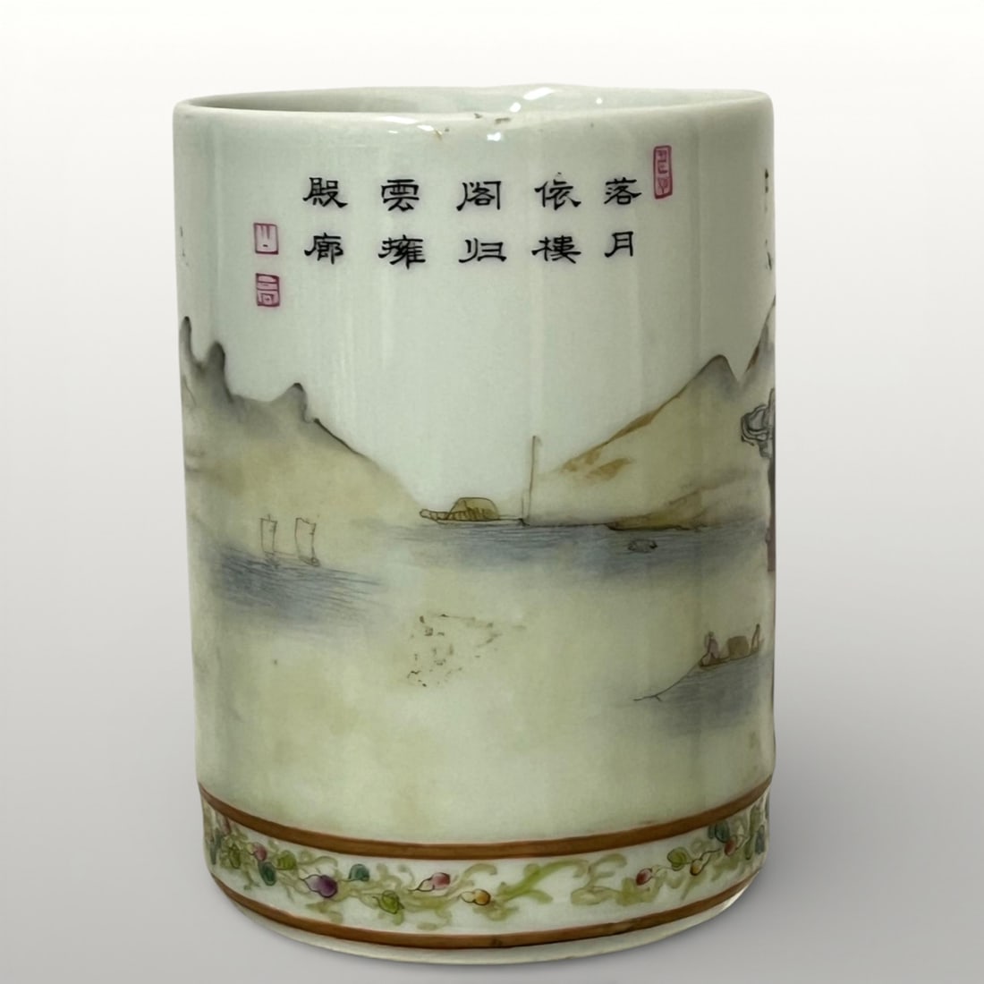 Bithong or pot à pinceaux de lettrado, China, Republic Period, 20th Century: Porcelain with polychrome overglaze decoration. Measures 12 x 8.5 cm. Cylindrical vessel intended for scholars, decorated with a continuous landscape of mountains, pagodas, bridges, and river scenes.