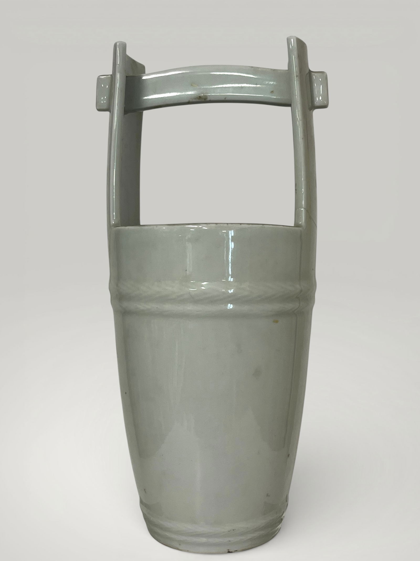 Cube-shaped vessel, Meiji Japanese porcelain, 19th century: Porcelain with monochrome celadon glaze. Dimensions not specified. This vessel is conceived as a formal reinterpretation of a traditional Japanese wooden cube, transformed here into a refined ceramic