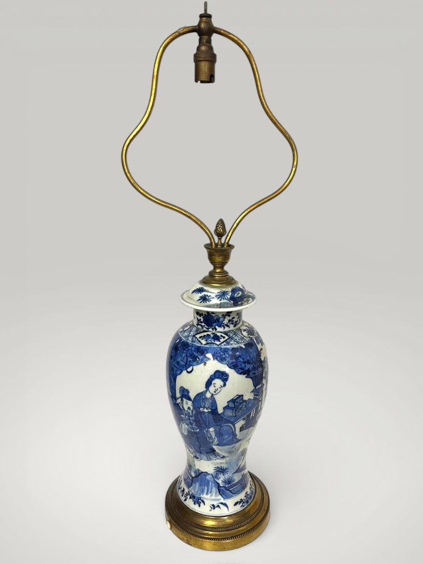 Baluster vase with courtly scenes, Qing Dynasty Chinese porcelain, 18th century: Underglaze blue porcelain. Dimensions not specified. Baluster-shaped vase decorated with figurative scenes arranged in narrative registers, depicting scholars and ladies of the court in an enclosed ga