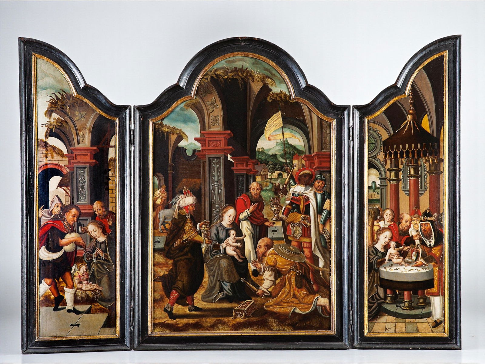 PIETER COECKE VAN AELST (Aalst, 1502 – Brussels, 1550) - The Adoration of the Magi (c. 1540): Oil on panel. Dimensions: 90 x 106 cm. Triptych composed of three panels depicting scenes from the childhood of Christ: the central panel, the Adoration of the Magi; the left panel, the Adoration of t