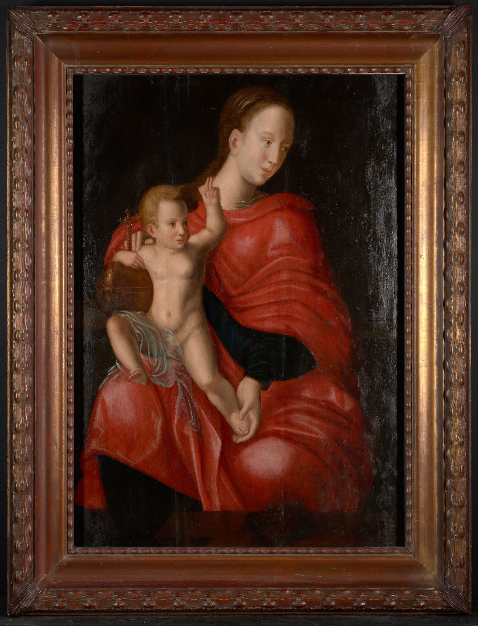 Style of Joos van Cleve - Virgin and Child dressed in red, 16th century: Oil on panel. Dimensions: 105 × 73.5 cm. This devotional painting depicts the Virgin Mary holding the Christ Child, unusually represented in a red tunic instead of the traditional blue mantle—a col