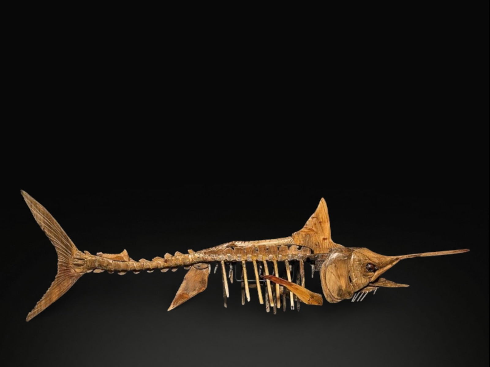 Wooden marlin skeleton, USA, 20th century: Wood. Dimensions: 189 × 50 × 25 cm. Large-format wooden sculpture depicting a marlin as a skeletal anatomical study. The hand-carved and assembled piece combines an almost scientific approach with a