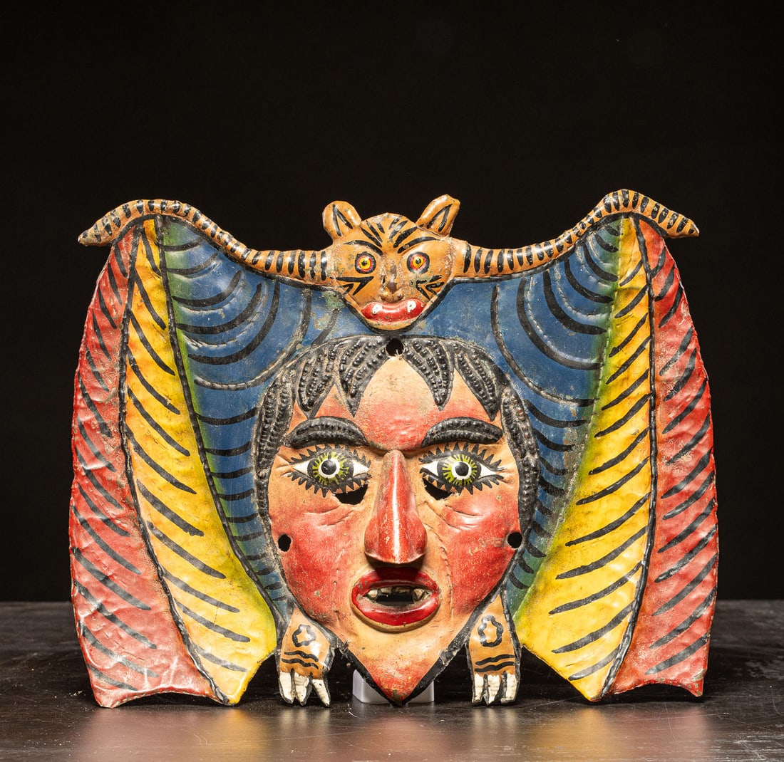 Bat dance mask. Nahua people, Mexico. 19th–20th century: Hammered copper. Dimensions: 39 × 30 × 4 cm. Ritual mask made of hammered copper, used in ceremonial dances of the Nahua people, where the bat figure holds symbolic meanings associated with night, t