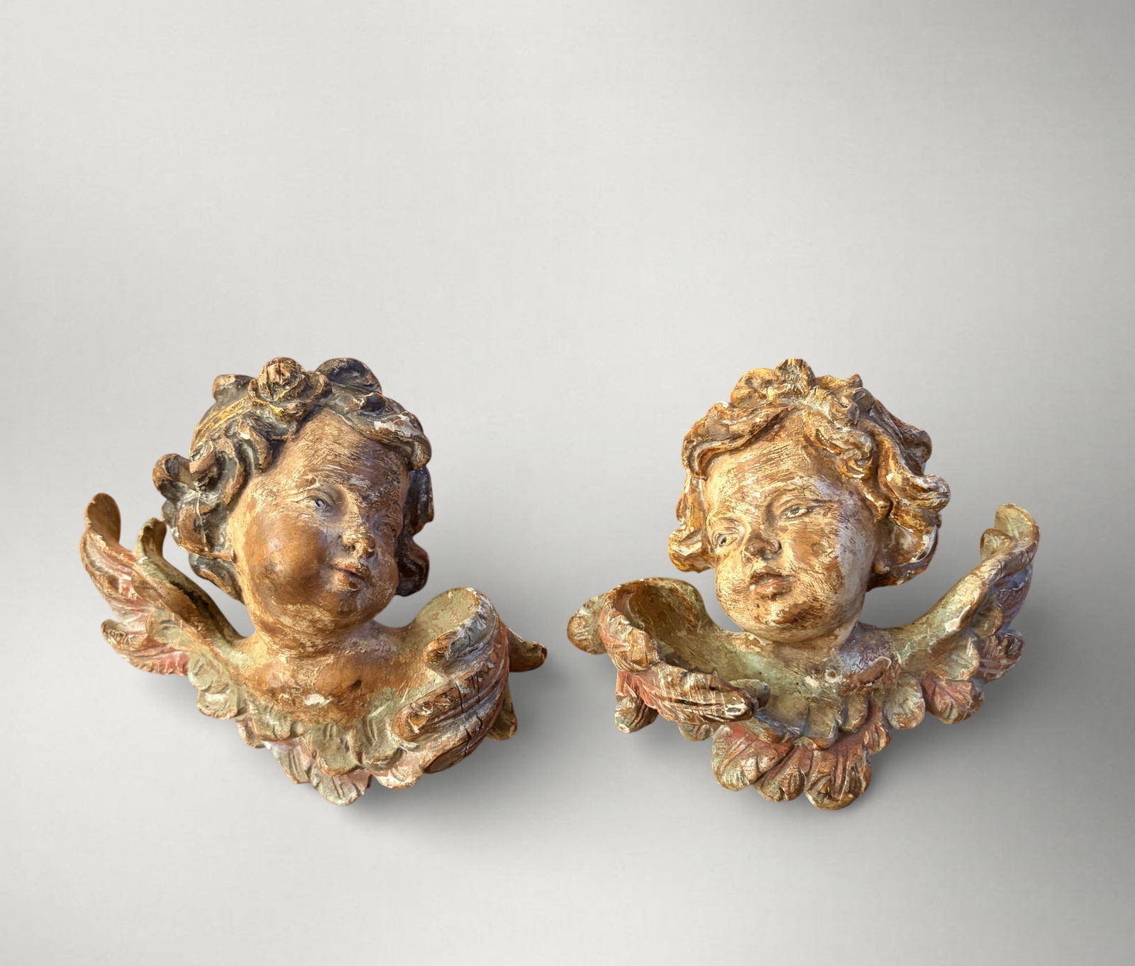 Pair of carved and polychrome wooden angel appliques, Spain, 20th century: Carved and polychrome wood, 12 x 5 cm.