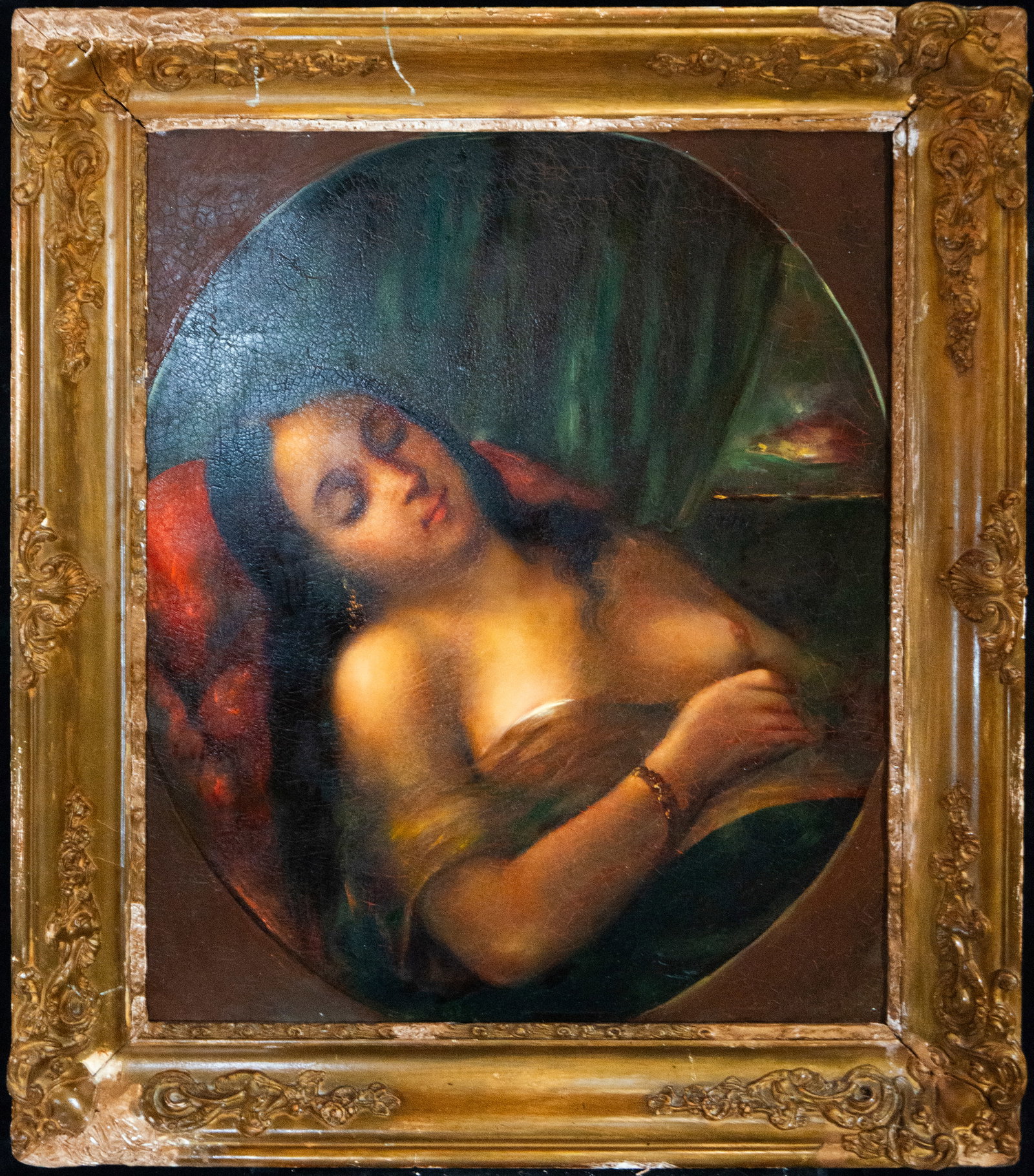 Female figure in tondo, European School, 19th century: Oil on canvas. Dimensions 54 x 44 cm; framed 67 x 57 cm. A female portrait arranged in a circular format, with the figure reclining and enveloped in an intimate atmosphere marked by soft, enveloping l