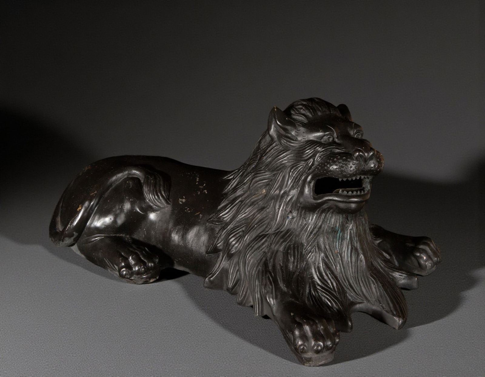Sculpture of a reclining lion. European school. 20th century. (1 of 3)