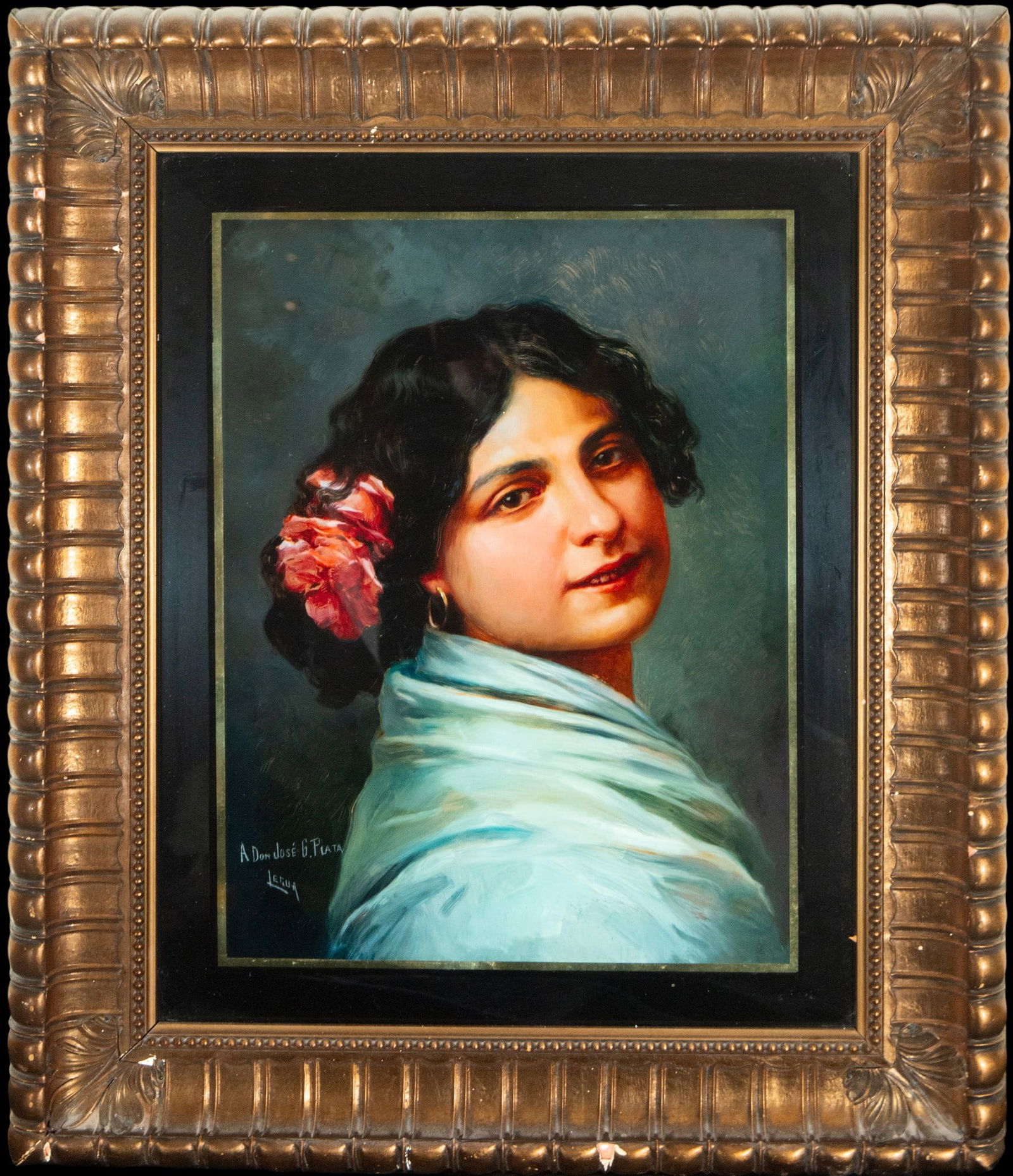 Portrait of a Gypsy woman. Signed. Spanish School. 20th century.: Oil on glass. Dimensions: 45 x 32 cm and 69 x 54 cm. Half-length portrait of a young Gypsy woman, depicted with a direct gaze and serene expression, wrapped in a shawl of bluish tones that contrasts w