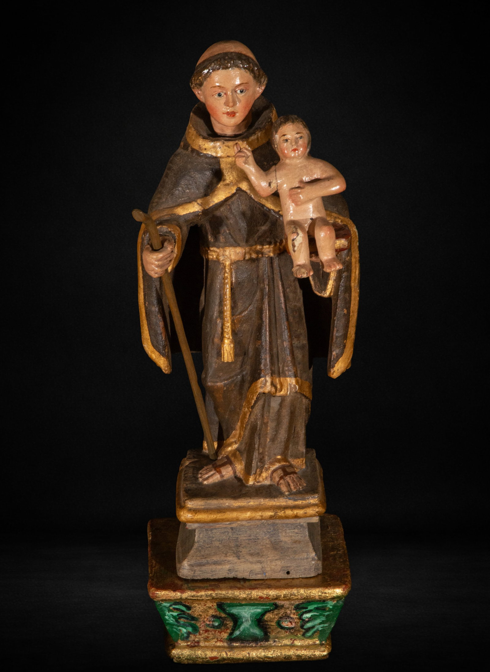 Saint Anthony with Child, 18th Century: Carved and polychromed wood. Measures 39 x 12 x 10 cm. Saint Anthony with Child, in vertical composition wearing Franciscan habit, dating from the 18th century.