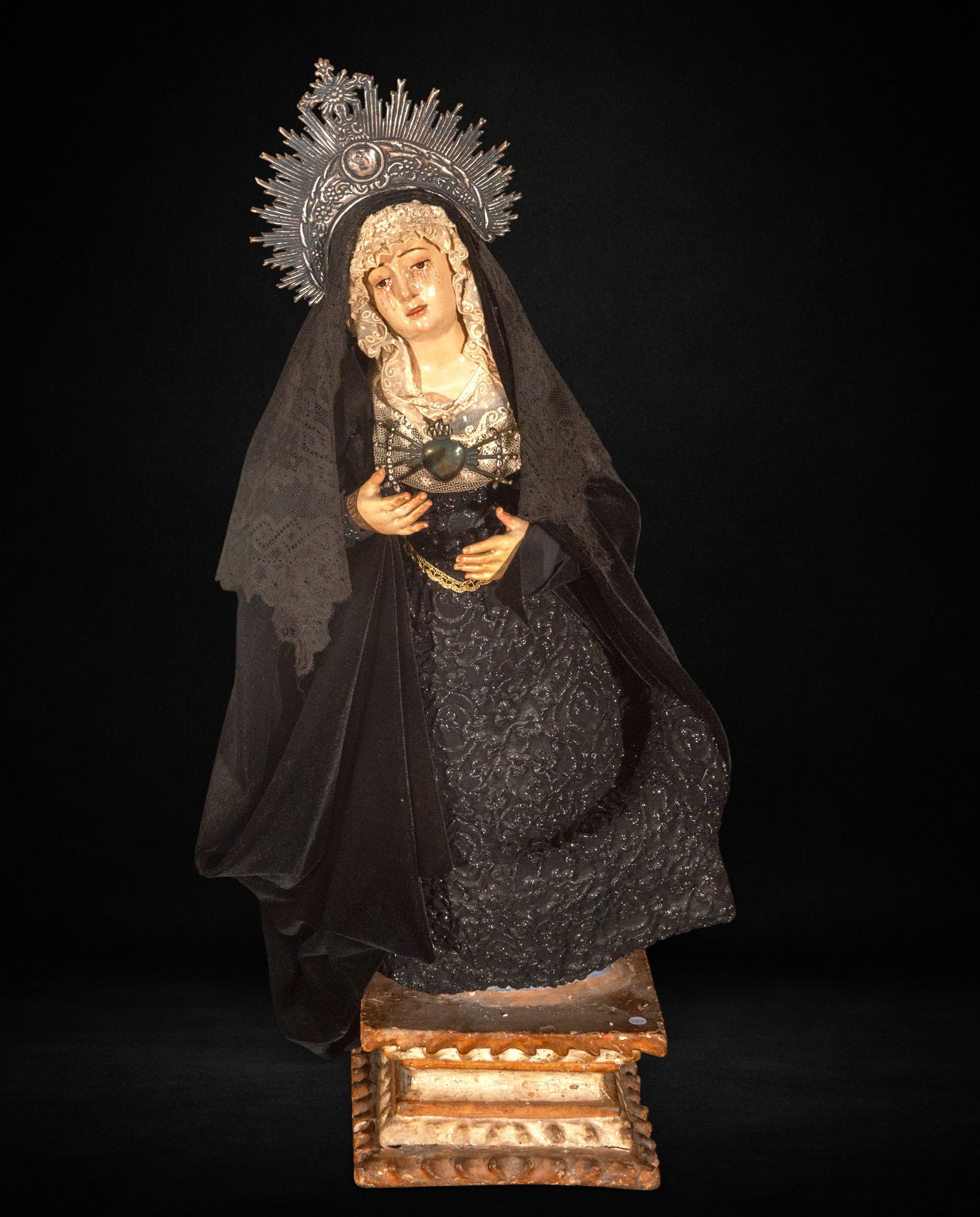 Dressed Virgin of Sorrows, late 18th/early 19th century: Carved and polychromed wood, draped in fabric. Measures 65 x 30 x 23 cm. A dressed Virgin of Sorrows with a sorrowful expression and open hands, dating from the late 18th or early 19th century.