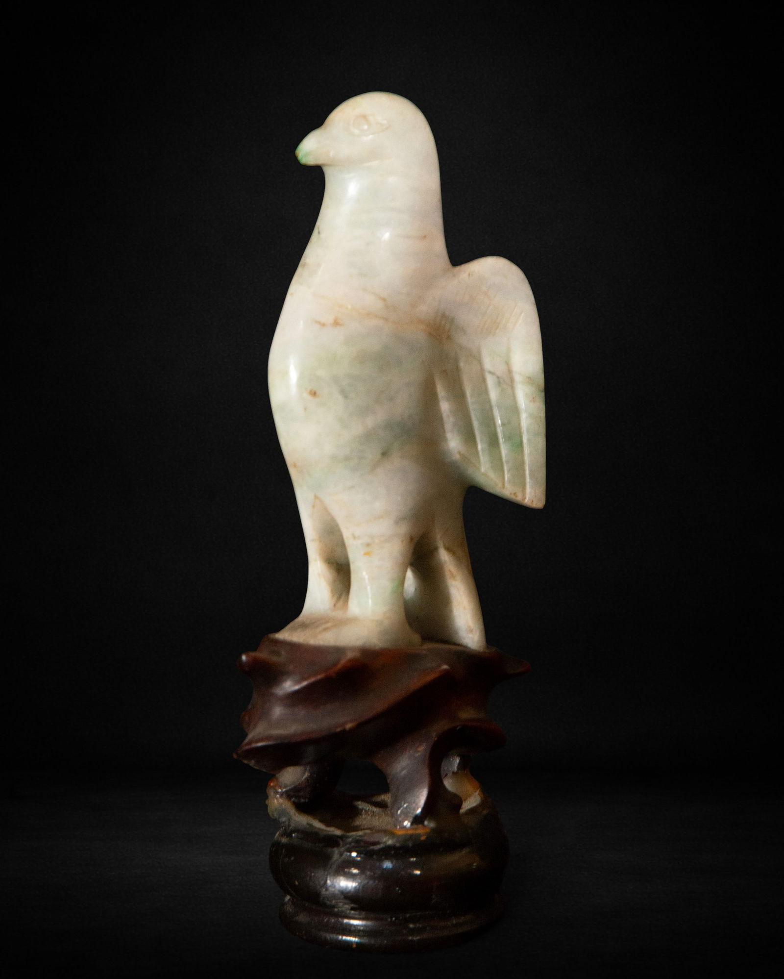 Falcon possibly made of jade: Falcon, possibly made of jade, measures 12 cm x 33 cm x 5 cm