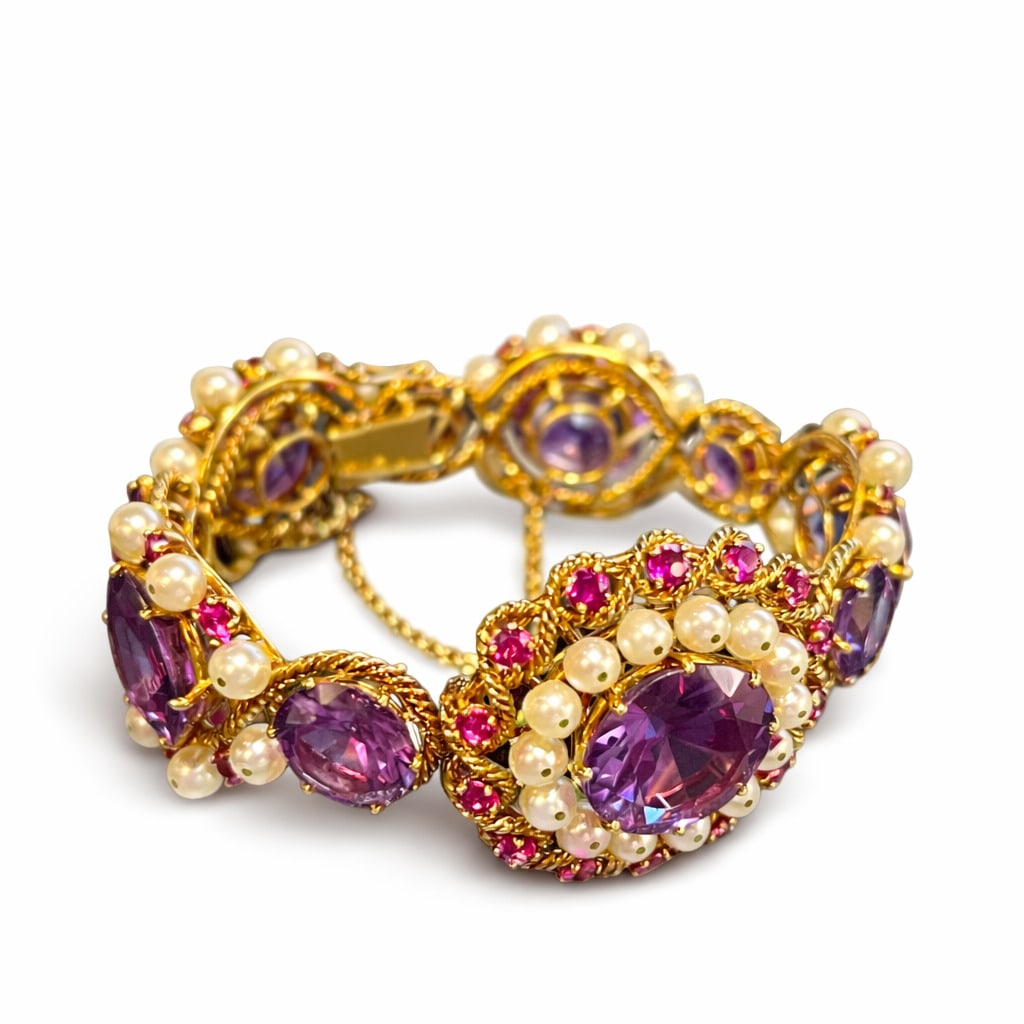 EXCEPTIONAL 74.6G IN 18K GOLD BELLE EPOQUE BRACELET: Set with freshwater pearls, rubies, and corundum that change color to a deep navy blue with sunlight exposure. Gross weight: 74.6g. Net weight of gold only: approximately 57.5-60g. Inner diameter: 6 x