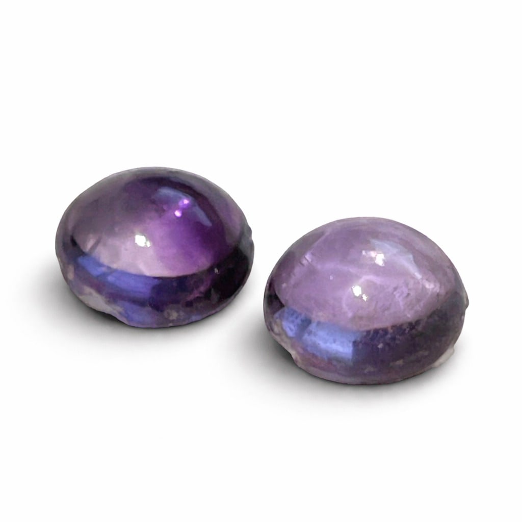 PAIR OF AMETHYST CABOCHONS TOTALLY 4.20CT: 2.10CT EACH, 4.20CT TOTAL. PROVENANCE: STOCK OF A RETIRED JEWELER.
