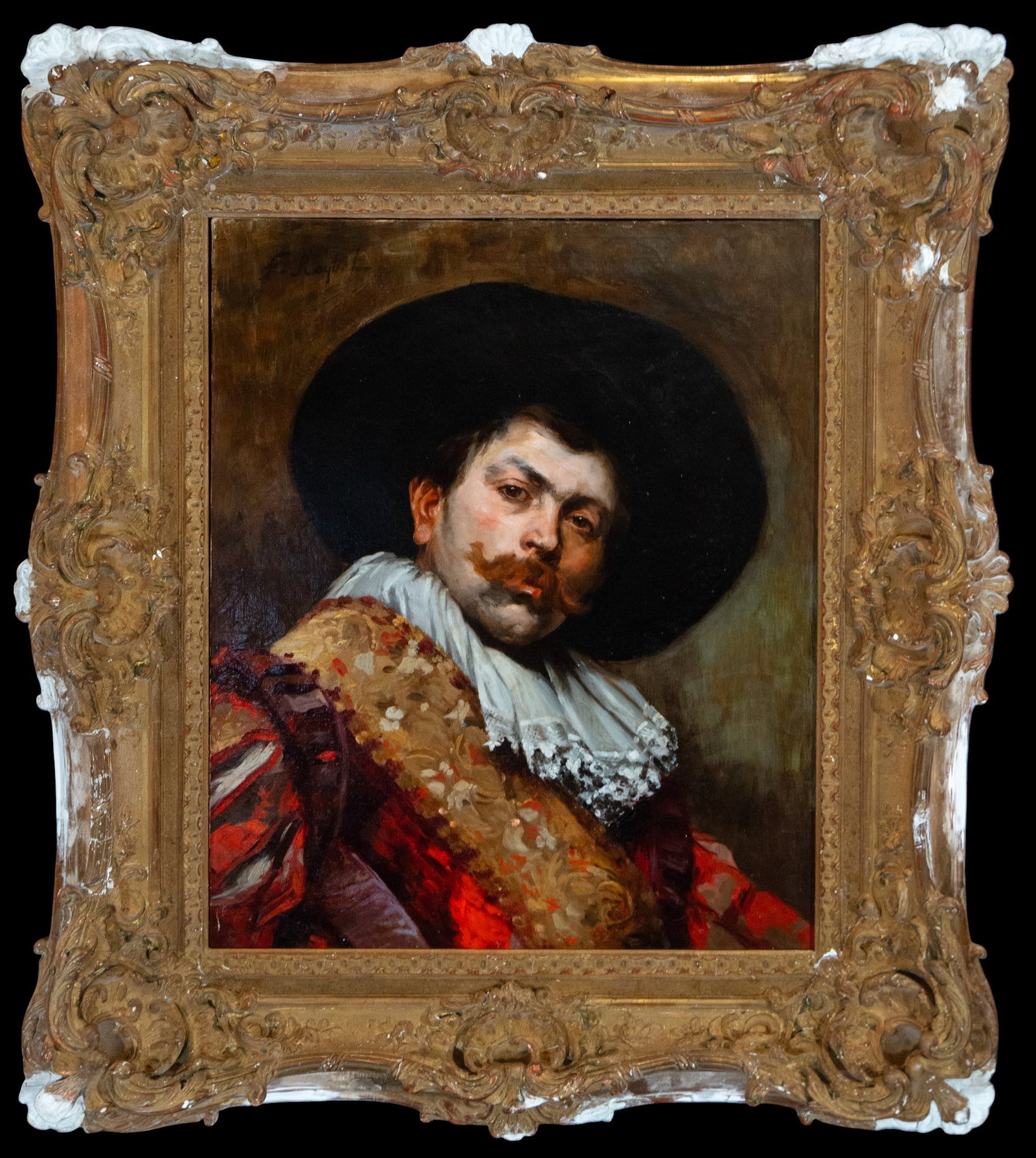 Ferdinand Victor Léon Roybet (1840 – 1920) Musketeer: Oil on canvas. Dimensions 65 x 54 cm; framed 100 x 85 cm. Bust portrait of a gentleman dressed in the style of the 17th century, wearing a wide-brimmed black hat and enveloped in rich attire of intens