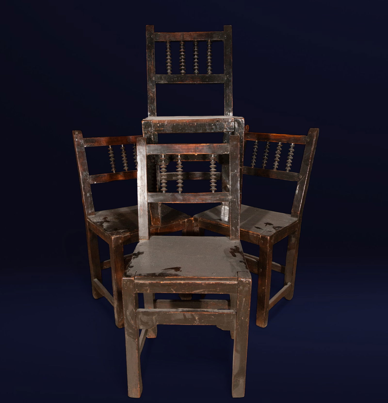 Lot of four chairs from Guadalajara, Spanish school, 17th century: Carved wood. Dimensions: approx. 89 x 42 x 35 cm. Set of four Guadalajara chairs with austere structures, straight backs, and turned slats, designed with a strong sense of functionality. Their austere