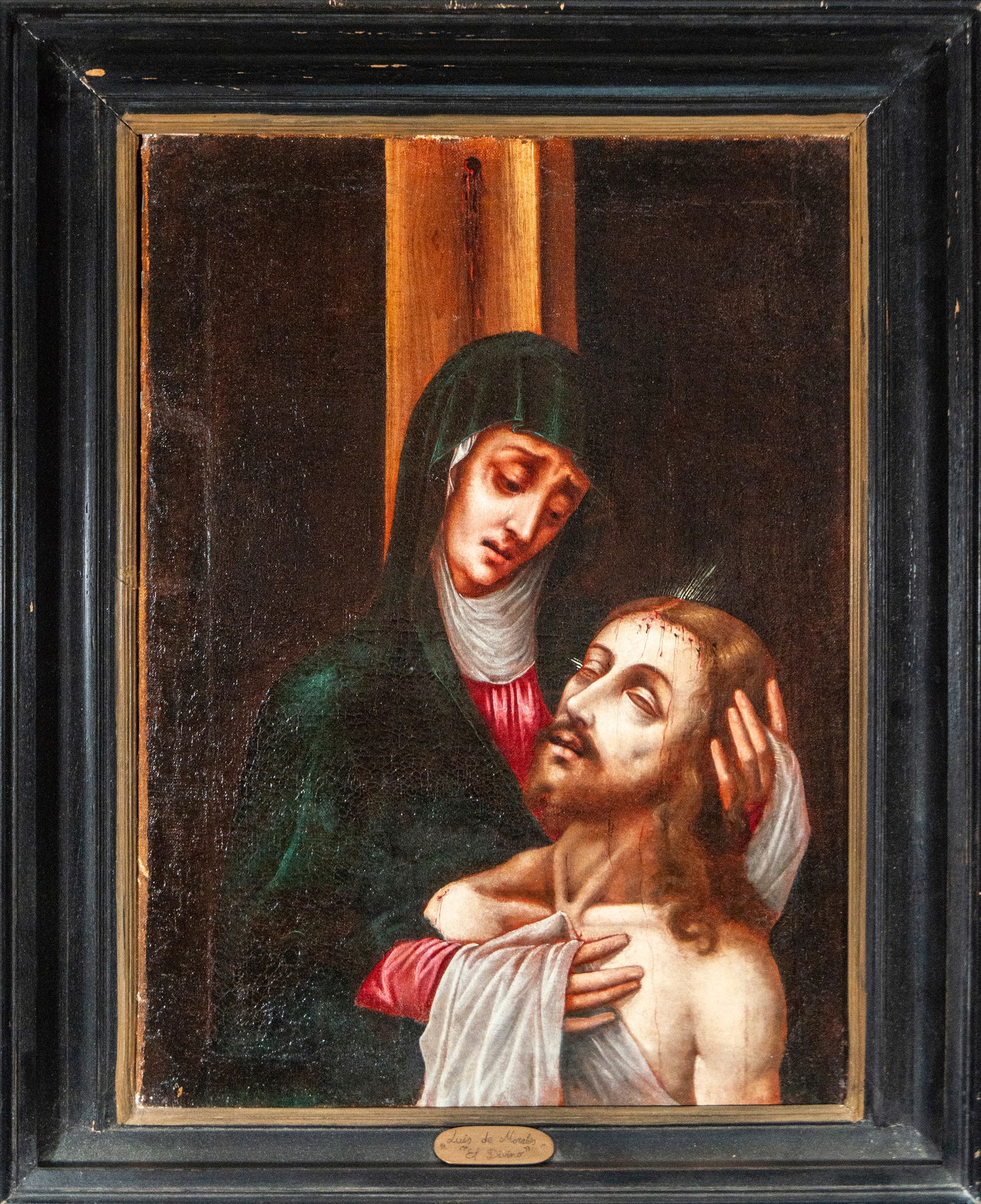 The Pietà, circle of Luis de Morales, Spanish School, 17th Century: Oil on canvas. Dimensions: 64 × 46 cm / 72 × 62 cm. A devotional composition depicting the Virgin Mary holding the body of Christ at the foot of the cross, in an image of intense, restrained emotion