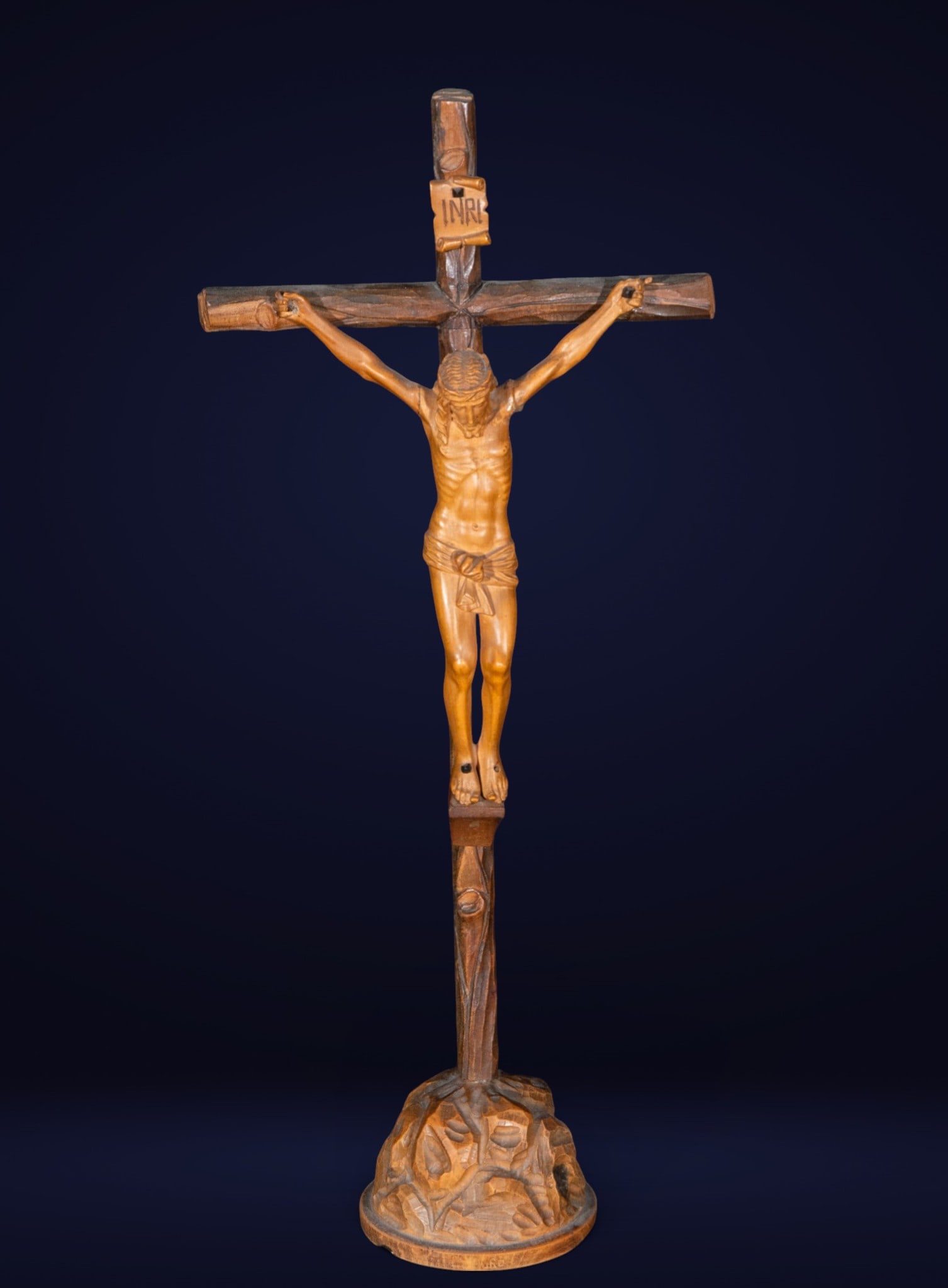 Christ crucified, Popular School, 19th Century: Carved boxwood. Dimensions: 35 × 16 × 8 cm. Small crucifix for domestic devotion, depicting a slender, simply carved Christ figure on a wooden cross with an INRI inscription. The figure's focus is o