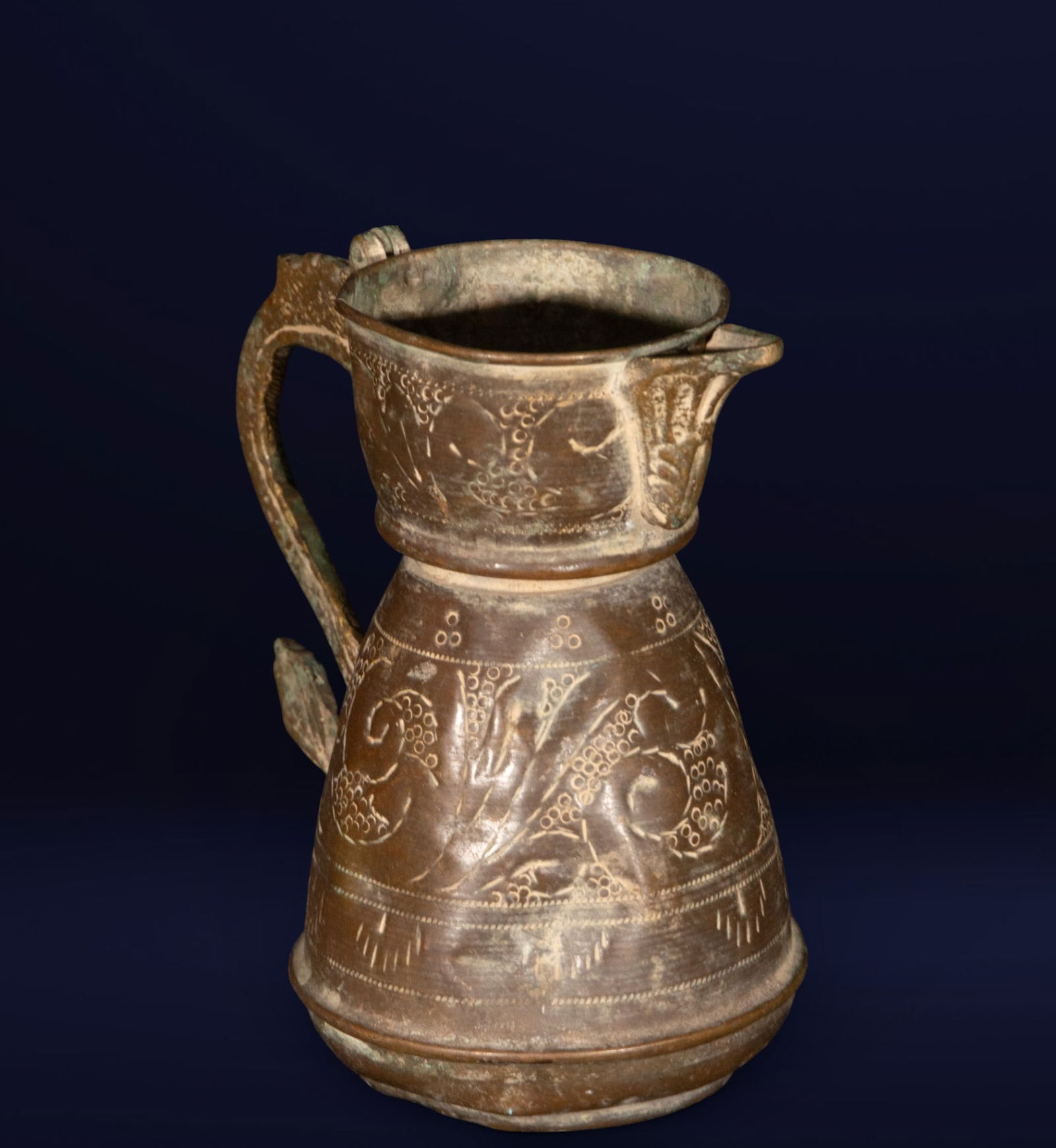 Metal jug, Hispano-Moorish school, 18th century or earlier: Worked and engraved metal. Dimensions: 14 × 14 × 10 cm. Truncated conical jug with a vertical handle and pouring spout, decorated with incised geometric and floral motifs. Its compact and utilitaria
