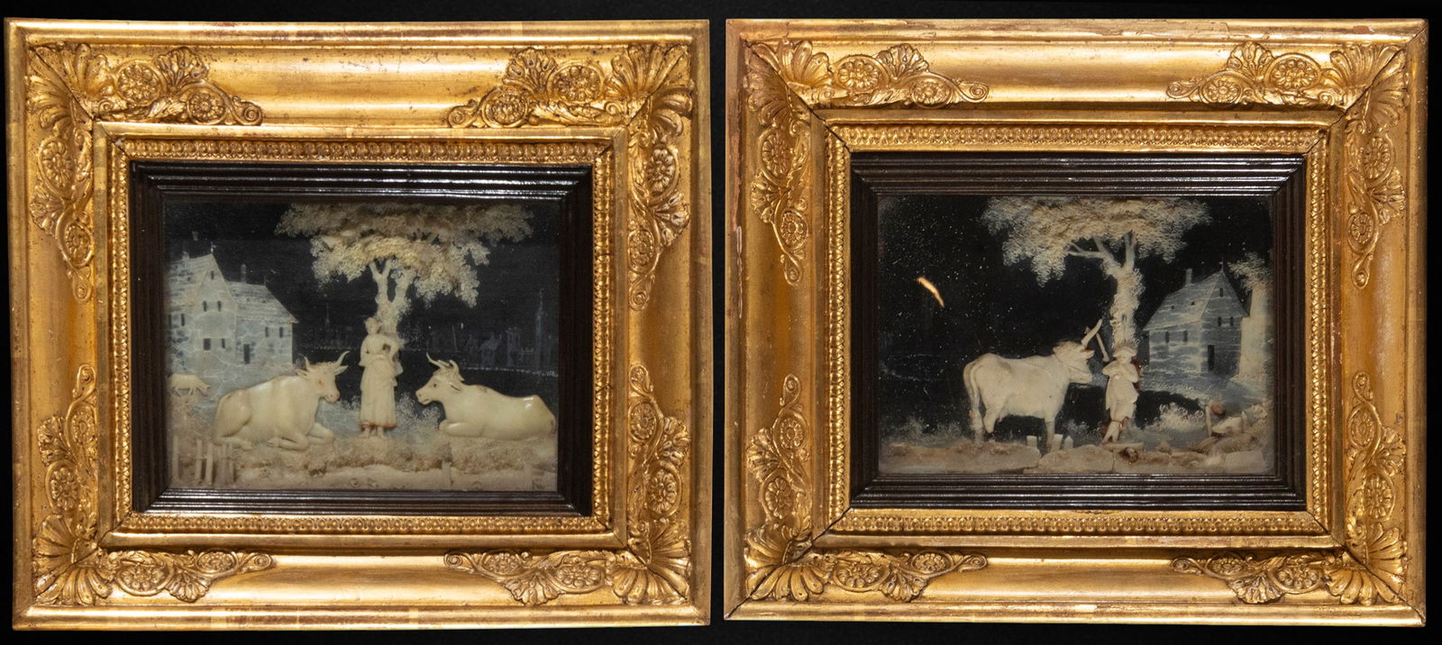 Pair of French wax dioramas, France circa 1800: Carved reliefs. Dimensions 18 x 13 / 20 x 26 cm. A pair of small, rural-themed compositions in which peasant figures, livestock, and architectural elements are arranged beneath broad-canopied trees, c