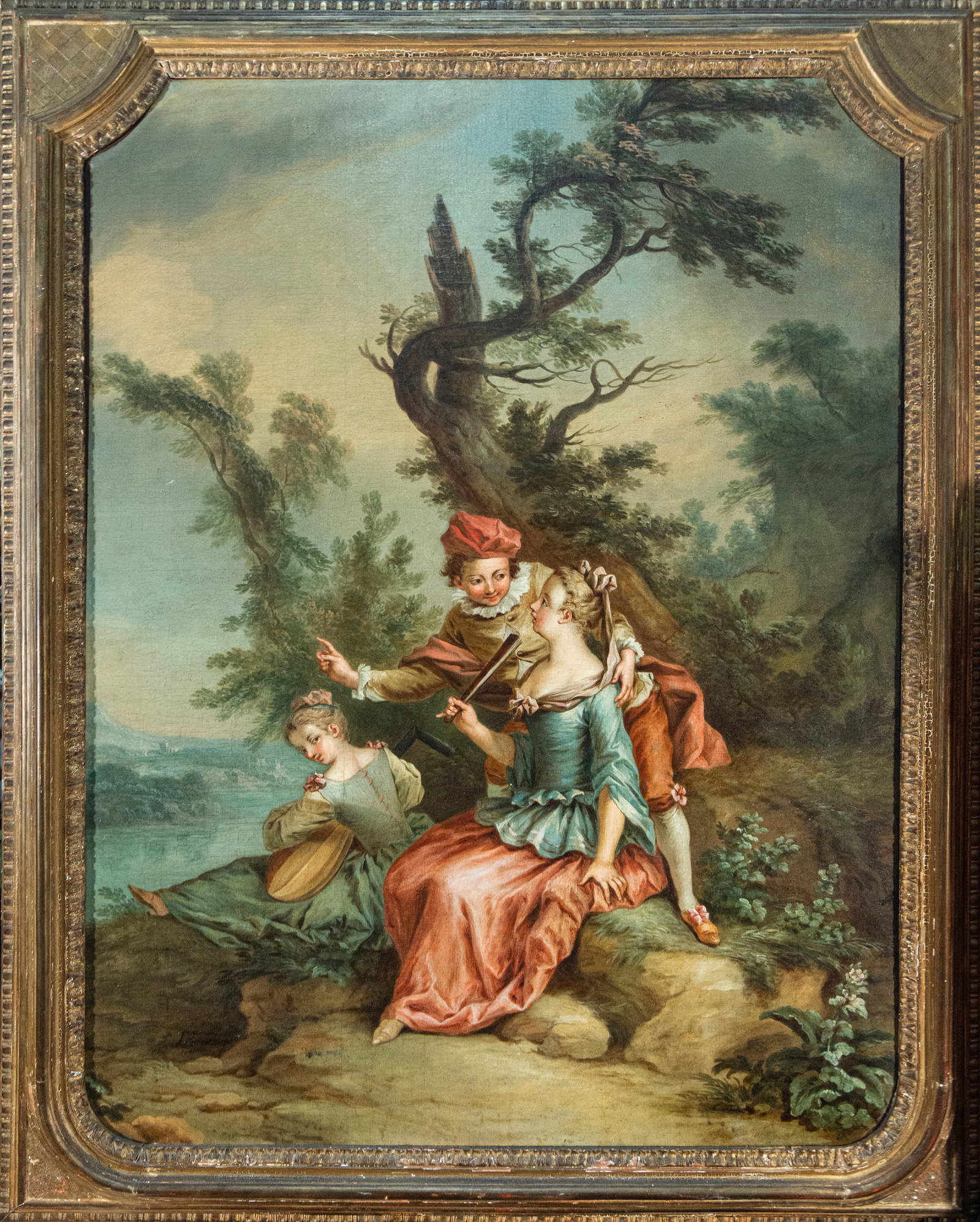 FEATURED LOT - FRENCH 18TH C - ATTRIBUTED TO FRANÇOIS BOUCHER AND HIS WORKSHOP, SIGNED: Oil on canvas. Dimensions 116 x 87 / 134 x 108 cm. A delicate, gallant scene set in a lush landscape, featuring a young woman seated in the foreground, accompanied by a gentleman who leans towards her