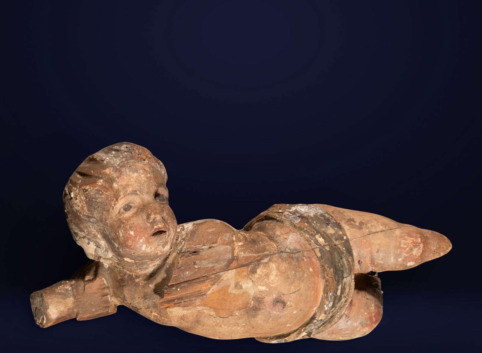 Angel, Spanish or Italian school, 17th century: Carved and polychromed wood, probably. Measures 64 x 23 x 16 cm.