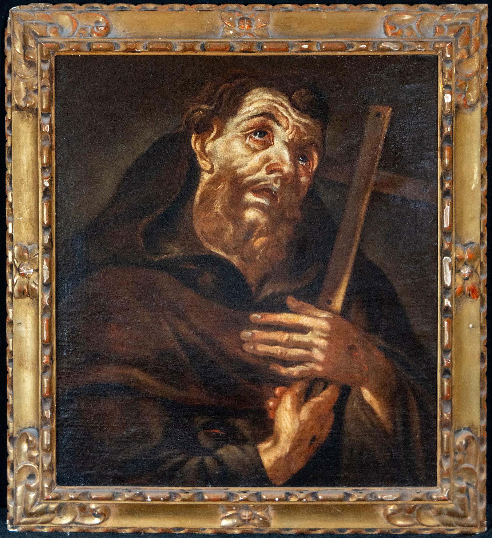 Saint Francis receiving divine inspiration. Neapolitan circle. 17th century: Oil on canvas. Dimensions 67 x 59 / 81 x 73 cm. A devotional scene centered on Saint Francis seated, receiving the Christ Child held by an angel while other celestial figures offer him a floral crown