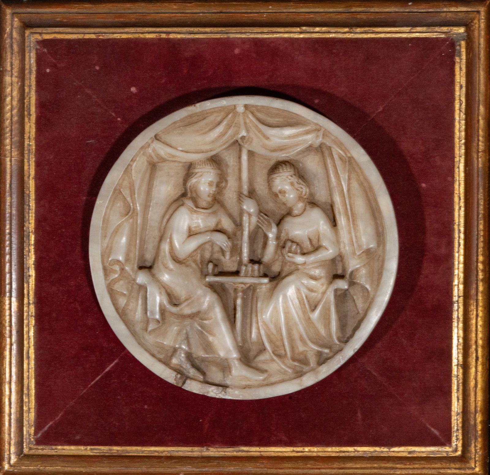 Alabaster relief with a medieval court scene. European school. 19th century: Carved alabaster. Measures 22 x 22 / 36 x 36 cm.