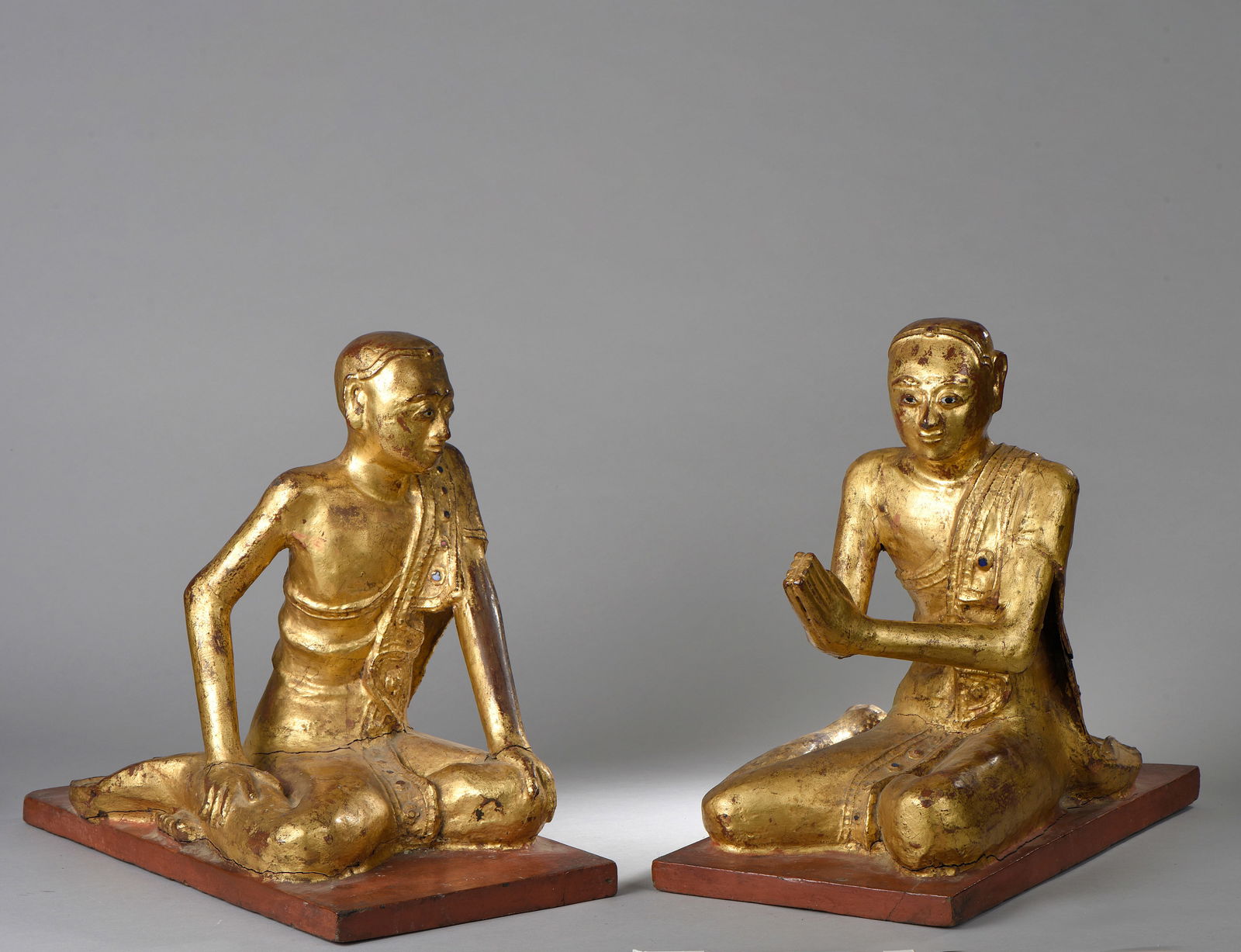 Pair of worshippers performing anjalimudra and relaxation, dressed in the utarasnaga monastic robe. (1 of 1)