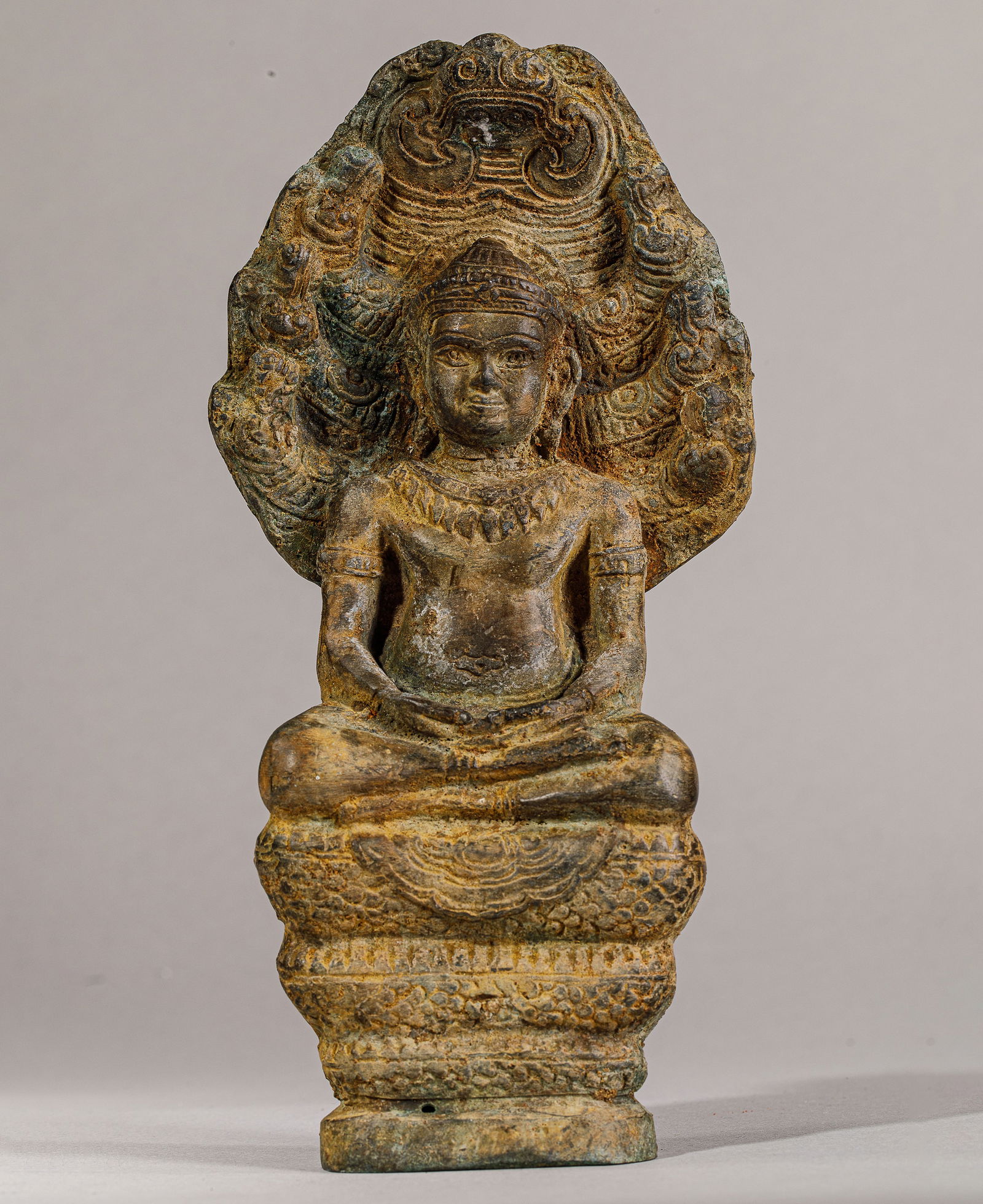 Buddha "Mucilinda" seated on the body of the Naga, protected by his septa-headed hood, to save him (1 of 10)