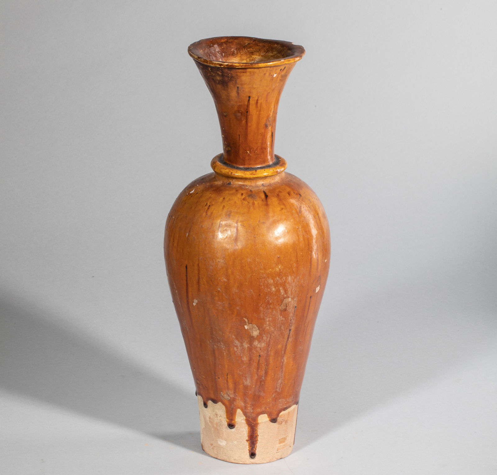 Tall bottle with a pear-shaped body on a narrow base and a tall, flared neck in terracotta with a (1 of 10)