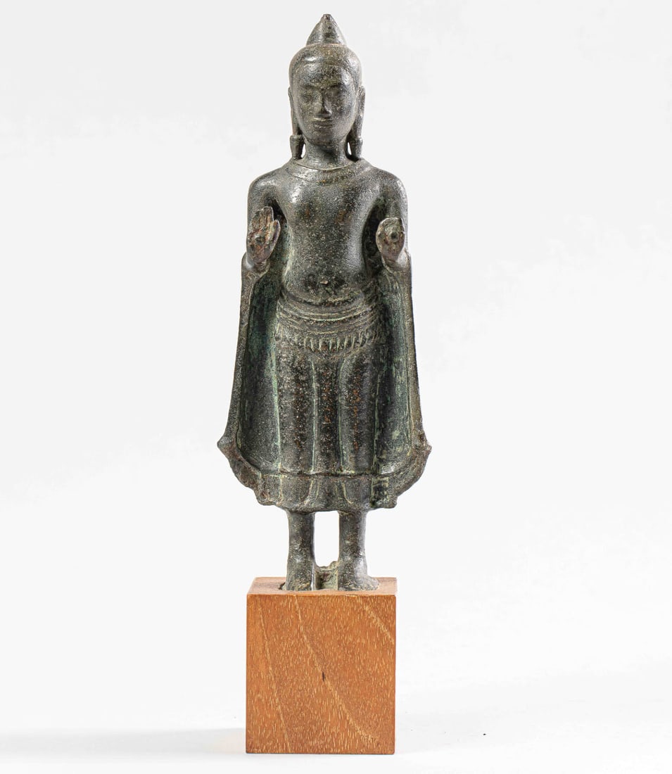 Standing Buddha with both hands in abayamudra, wearing the utarasanga monastic robe tied at the hips (1 of 6)