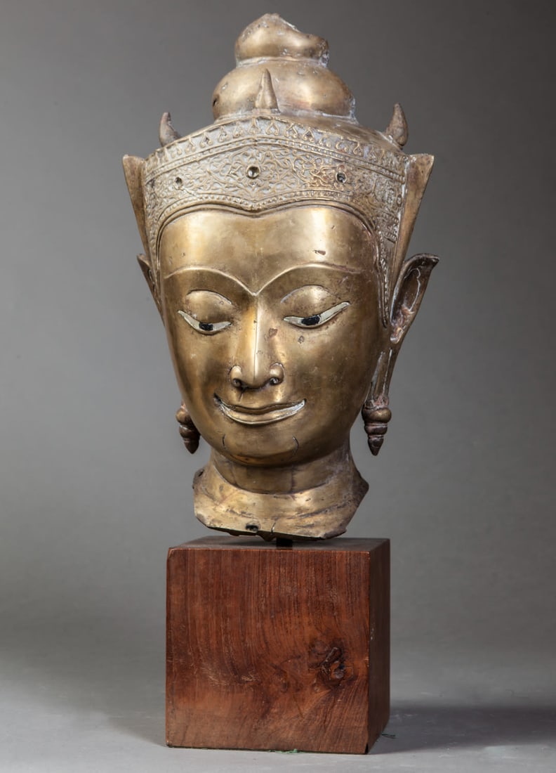 Crowned Buddha head with a serene expression, with half-closed eyes inviting one to look inward, (1 of 8)