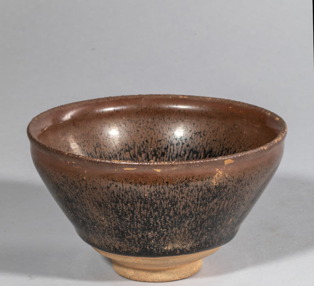 “Temmoku?? cup in sandstone with a brown coating called “hare fur, ?? imitating the animal’s (1 of 8)