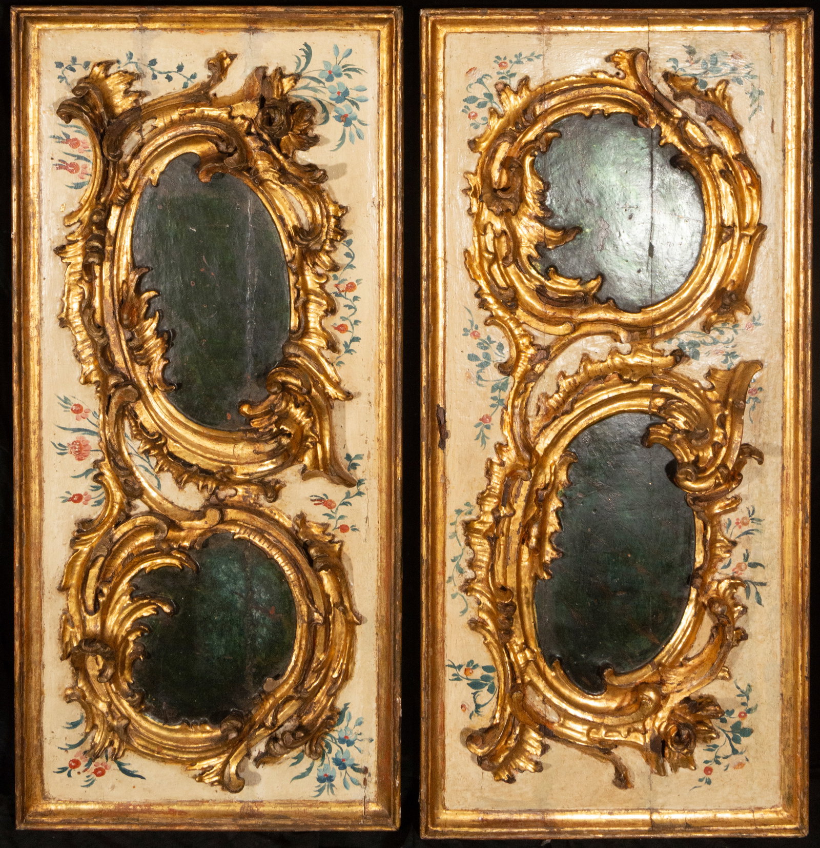 Pair of gilded and polychrome wooden panels, Italy, 18th century: Carved, gilded, and polychromed wood. Dimensions not specified. Pair of Italian panels decorated with floral garlands and rocaille cartouches with painted reserves in shades of green. The ensemble ref