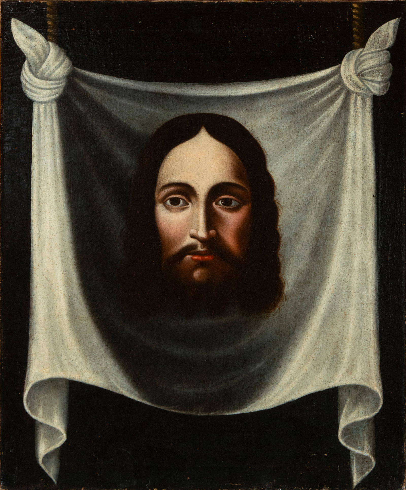 Santa Faz. Colonial viceregal school. 17th century.: Oil on canvas. Dimensions: 62 × 56 cm. Face of Christ above Veronica's veil, centered in a symmetrical composition with a neutral background. The face, frontal and with a serene expression, features