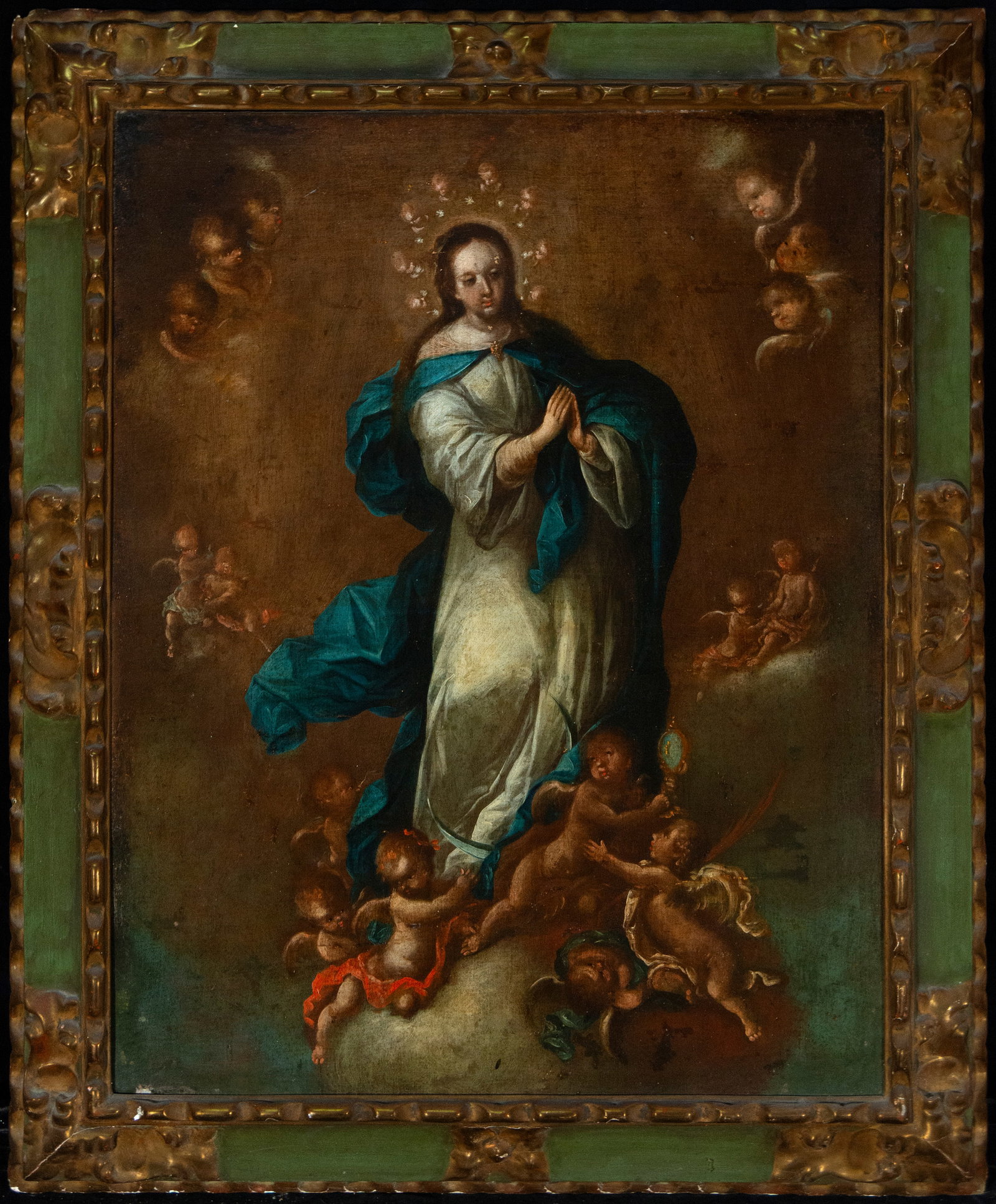Virgin Immaculate Conception, Colonial School of New Granada, 17th Century: Oil on canvas. Dimensions: 83 x 65 cm and 100 x 82 cm. The composition depicts the Virgin standing against a celestial background, surrounded by cherubs that frame her luminous figure. The palette com