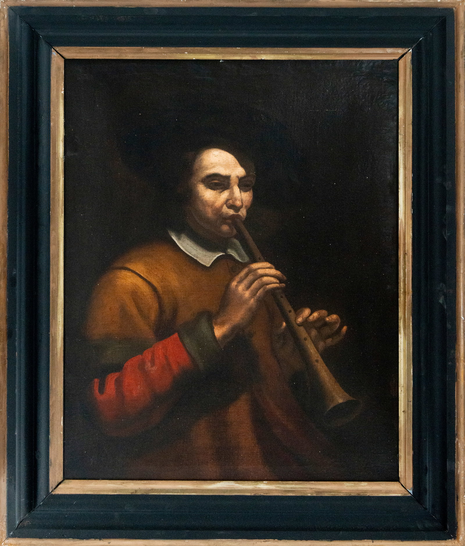 Musician with shawm. Neapolitan or Genoese Caravaggist school. 17th century.: Oil on canvas. Dimensions: 83 x 67 cm (unframed), 105 x 87 cm (framed). The painting depicts the bust of a musician intently playing a shawm, a double-reed wind instrument characteristic of the 16th a